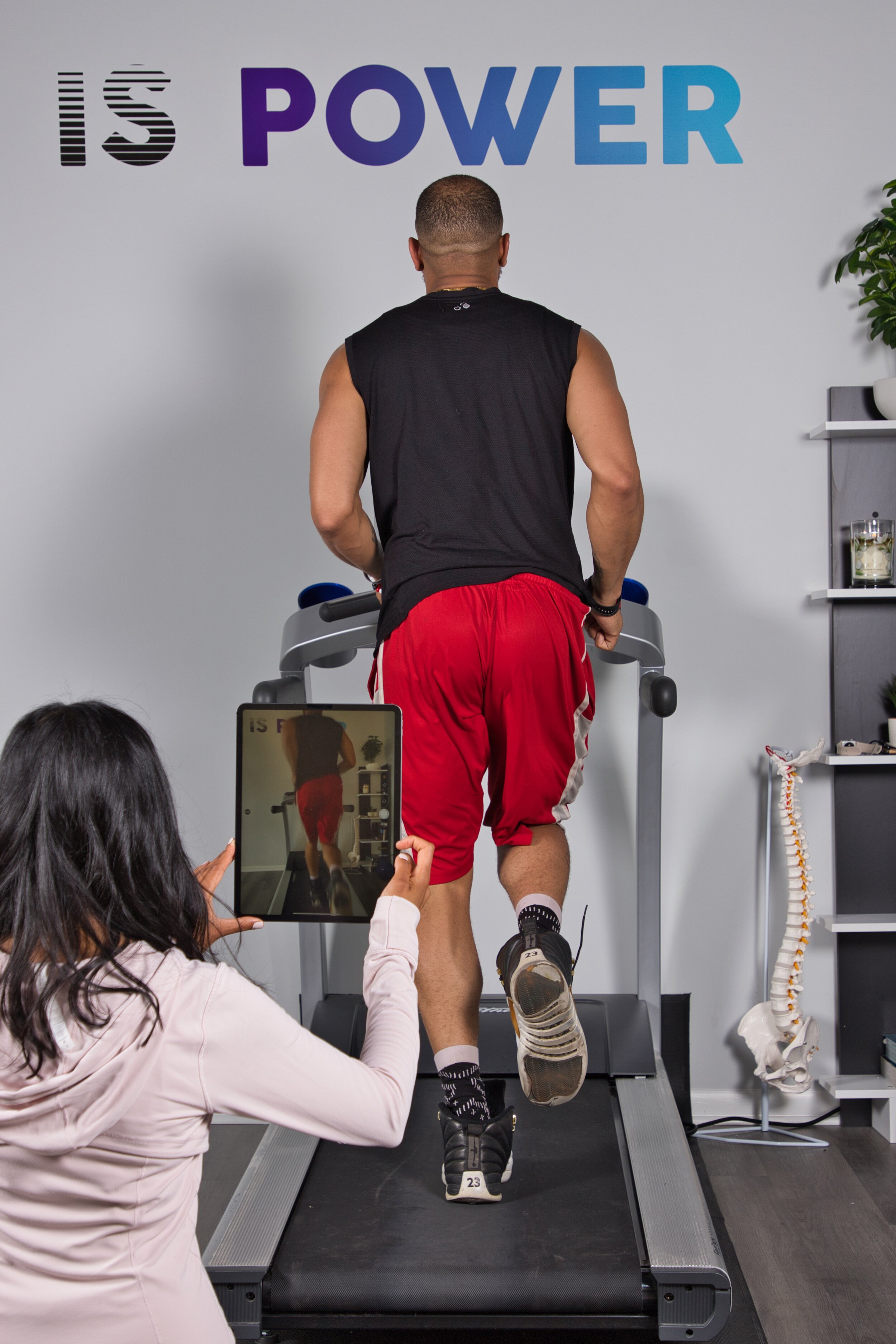 Man on a treadmill during a gait analysis exam.
