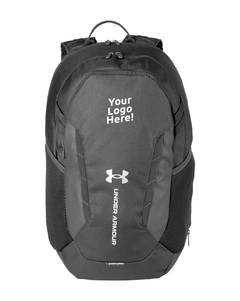 Black and gray Under Armour backpack with mesh side pockets and a space for custom logo.