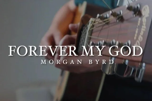 Close-up of a person's hand playing an acoustic guitar with the text 'Forever My God' and 'Morgan Byrd' overlaid.