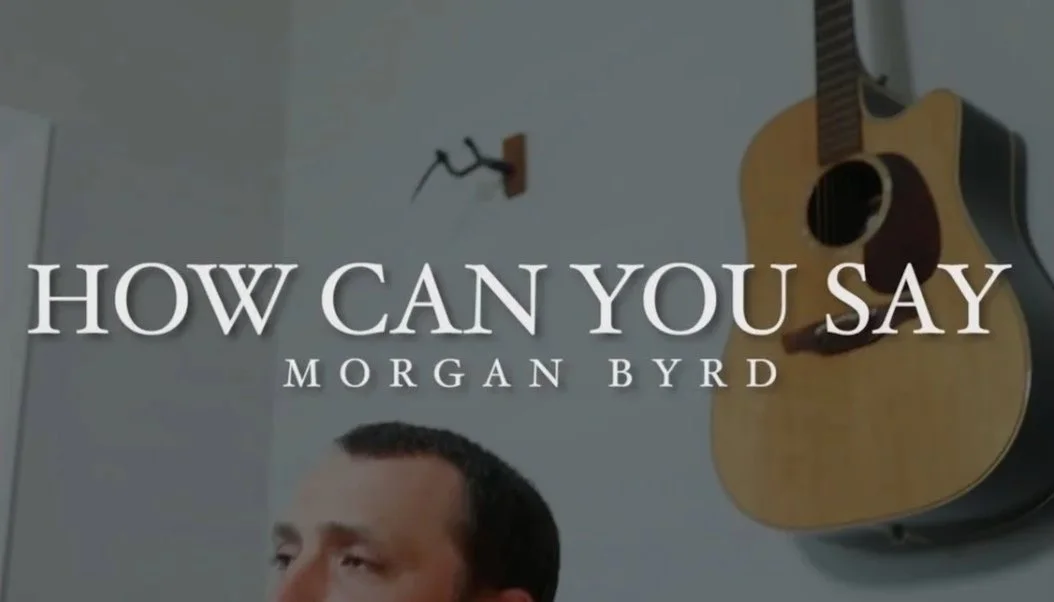 Book cover titled "How Can You Say" by Morgan Byrd, featuring a partial view of a man's head, an acoustic guitar on the wall, and a plain white wall background.