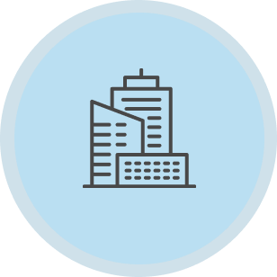 Line drawing of a cityscape with tall buildings on a light blue circular background.