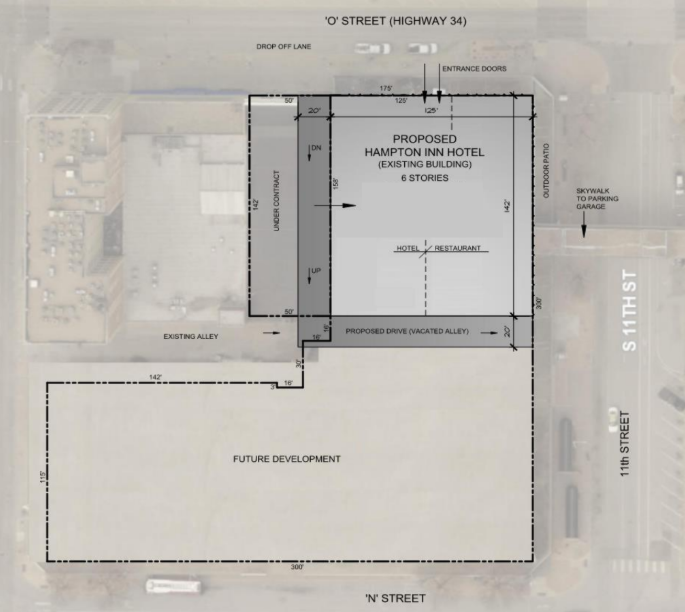 Site plan for a proposed hotel development on 'O Street' with surrounding streets, including 11th Street and North Street, showing existing buildings, future development area, proposed hotel with restaurant and driveway, and other infrastructure details.