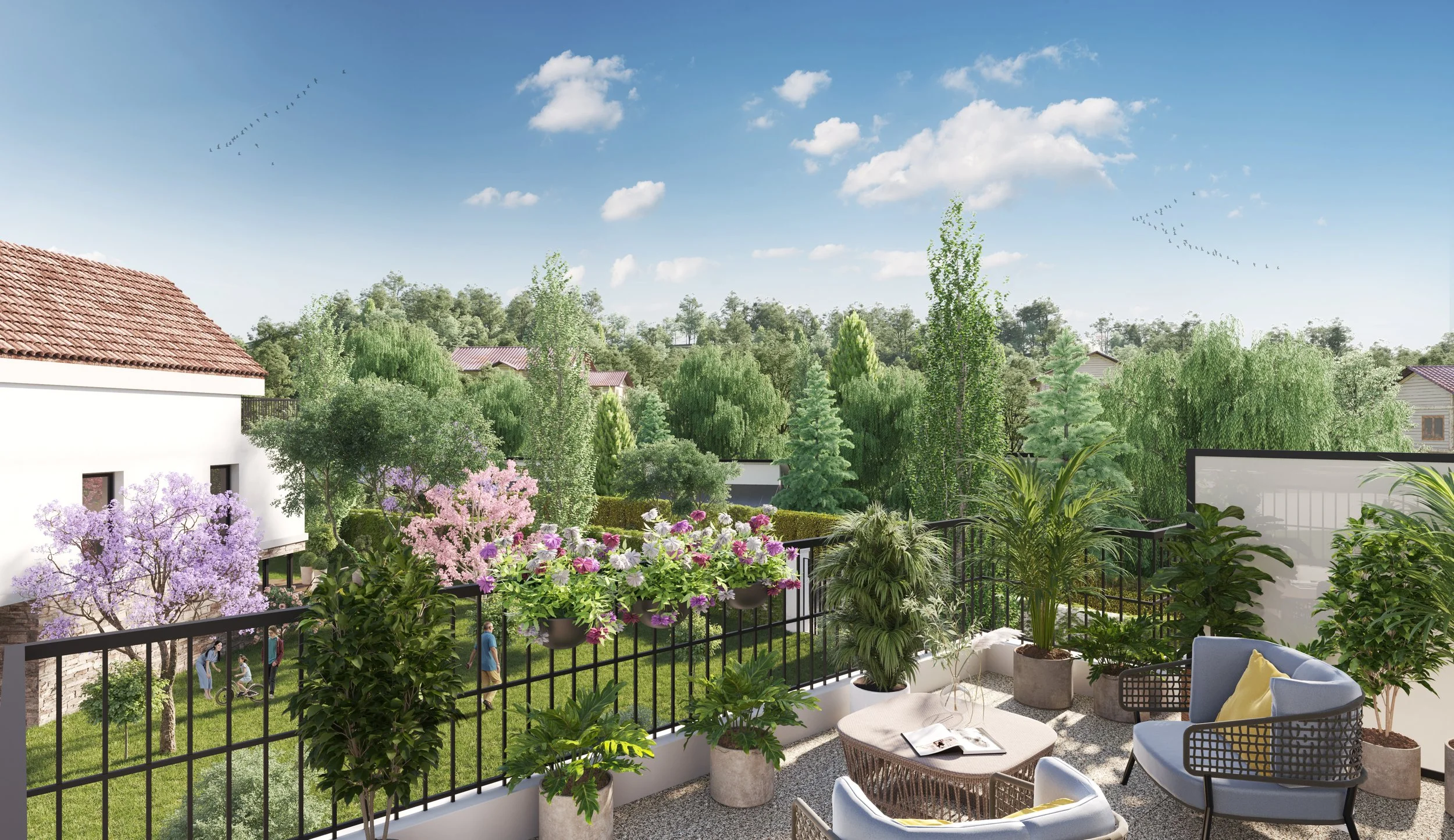 Vue terrasse Domaine Les Arômes | Balcon avec jardin luxuriant, plantes en pot, mobilier en coup de cœur, vue sur un jardin avec arbres, et ciel bleu avec quelques nuages et des oiseaux.
