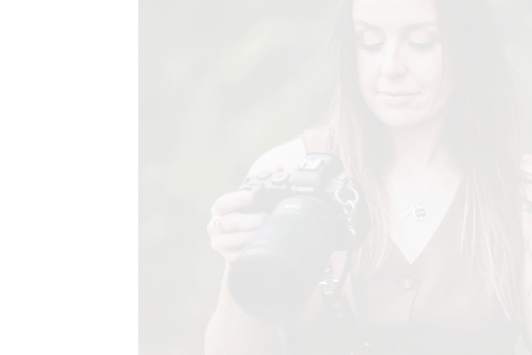 A woman with long brown hair and light makeup holding a Canon DSLR camera outdoors, looking at the camera with a slight smile, wearing a sleeveless brown top and a silver necklace.