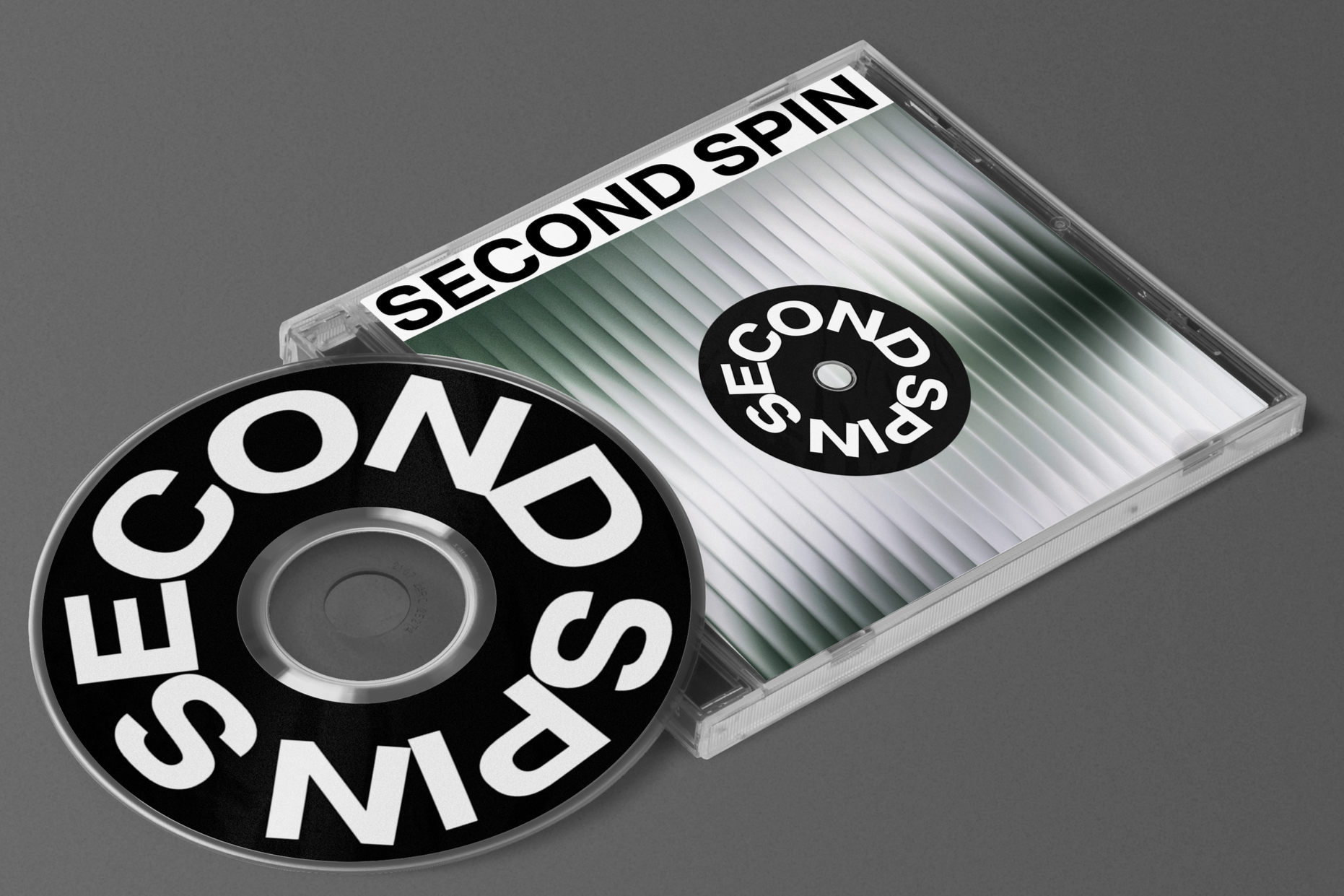 A CD case and CD with the text "SECOND SPIN" on the labels and case.