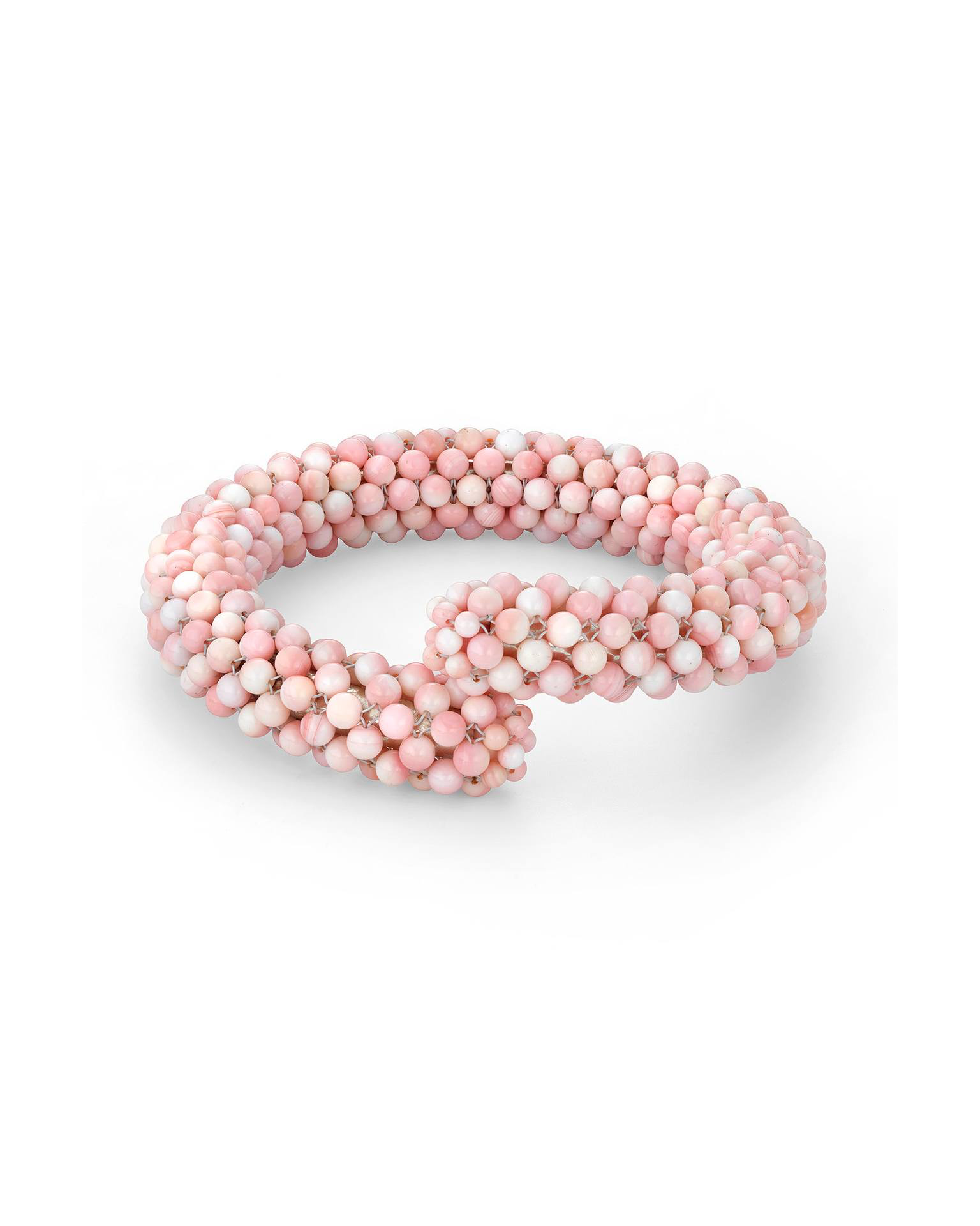 A pink and white beaded bracelet on a white background.