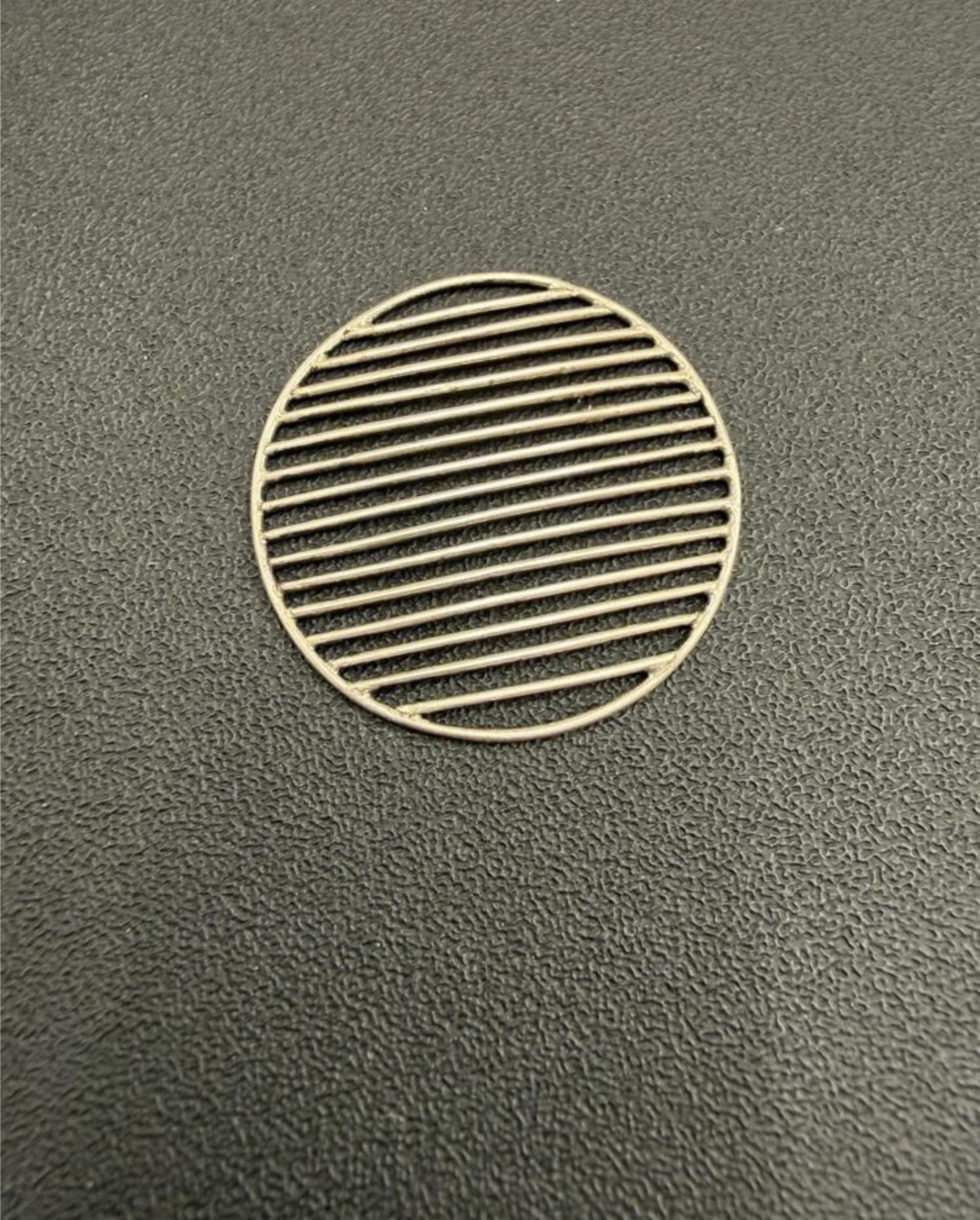 Single finished grid disc - AmyRoper Lyons.jpg