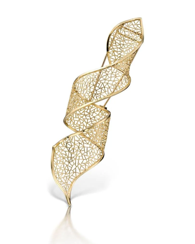 A gold, intricately designed, spiral-shaped decorative sculpture with a open lattice pattern.