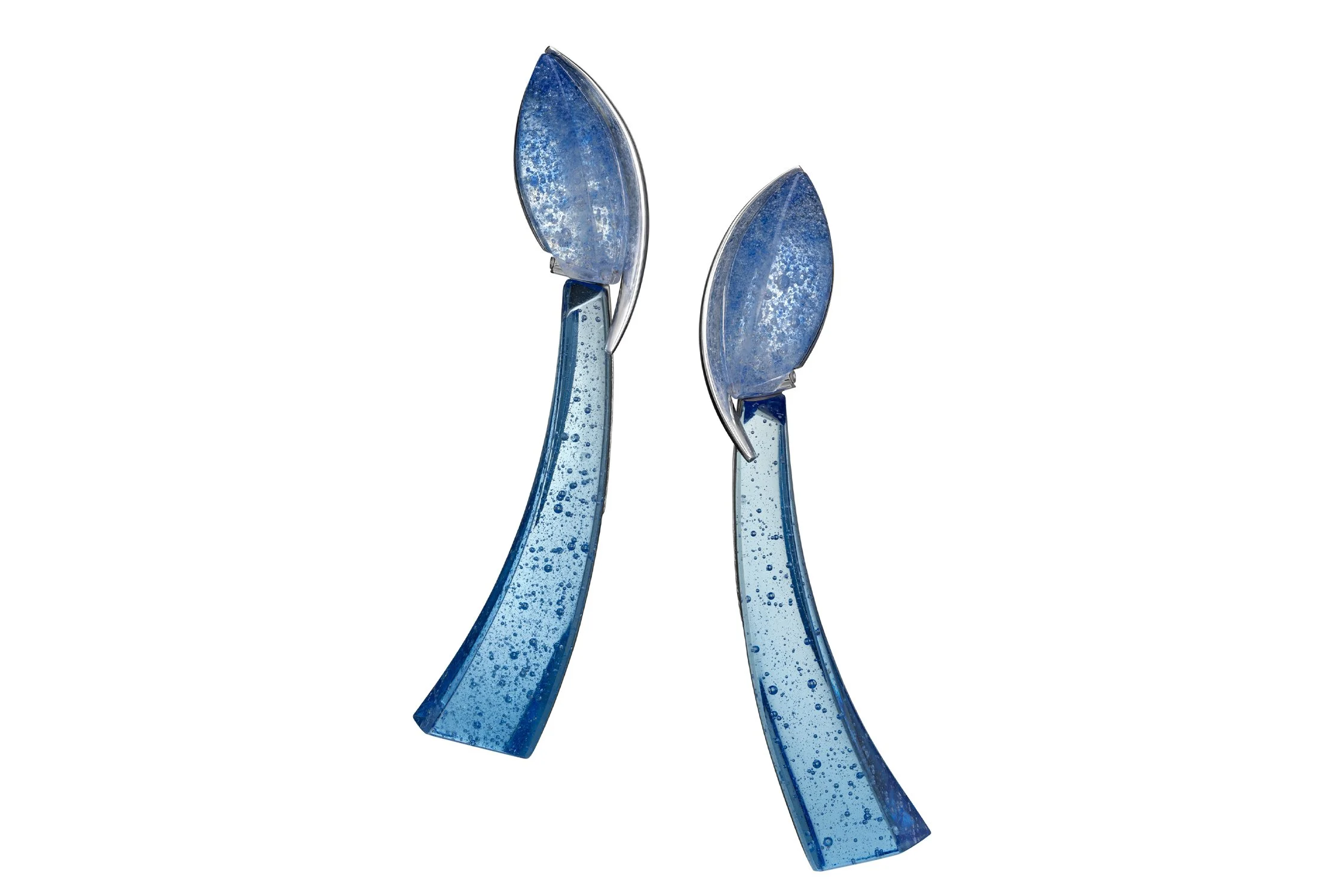 Two glass blue flower sculptures with elongated petals and stems, set against a white background.