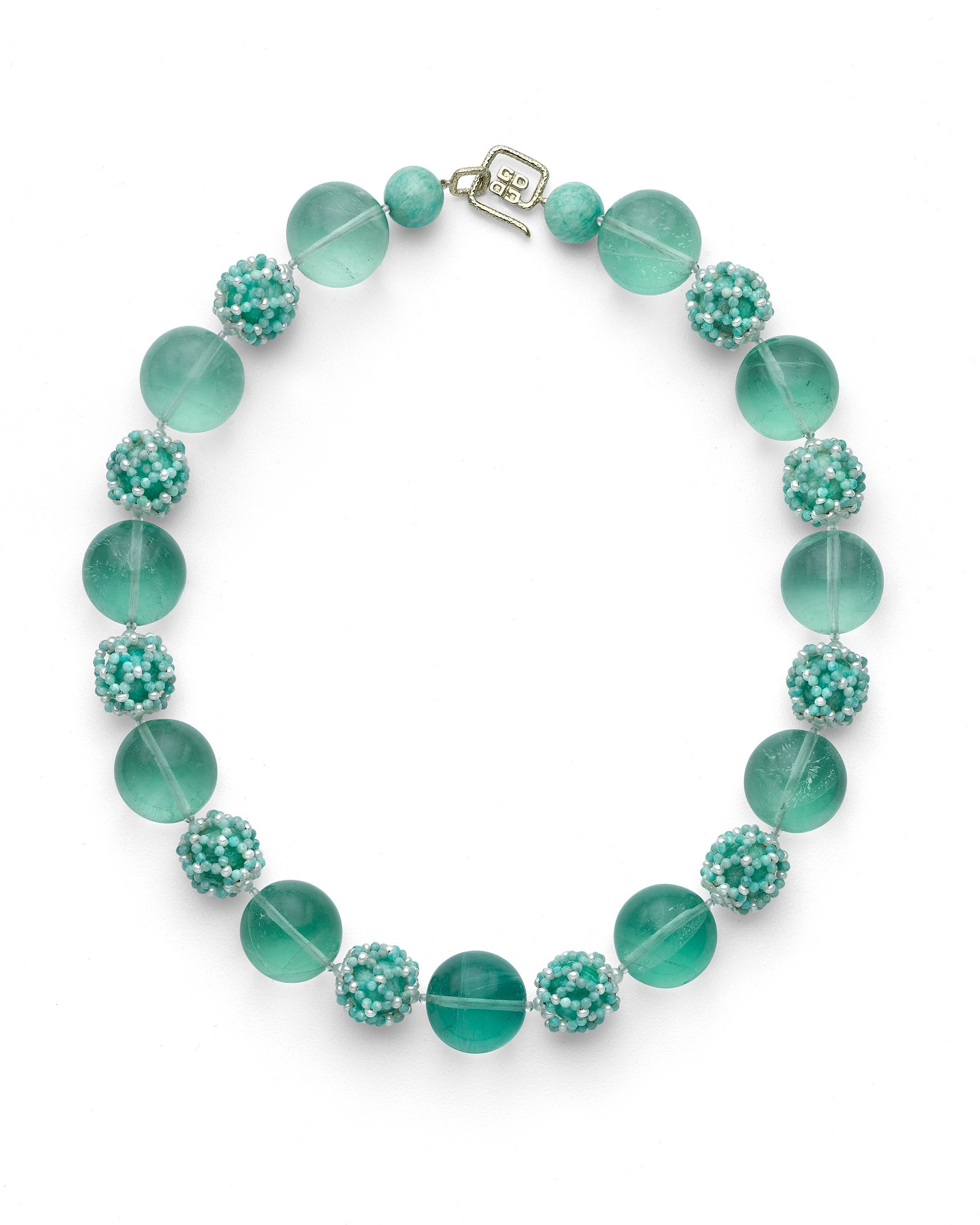 A necklace with alternating large round aquamarine beads and smaller spherical beads with turquoise and pearl accents, featuring a toggle clasp.