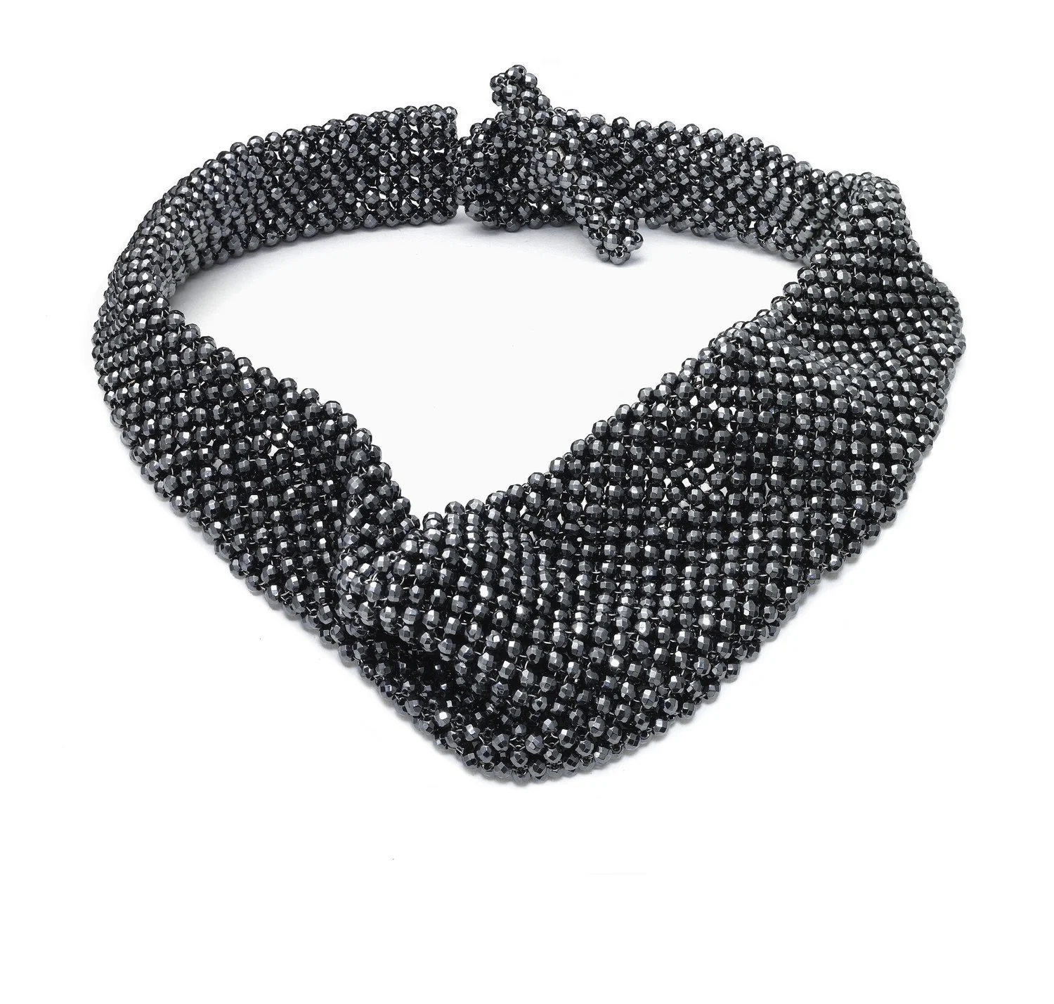 A black, beaded necklace shaped like Superman's logo on a white background.