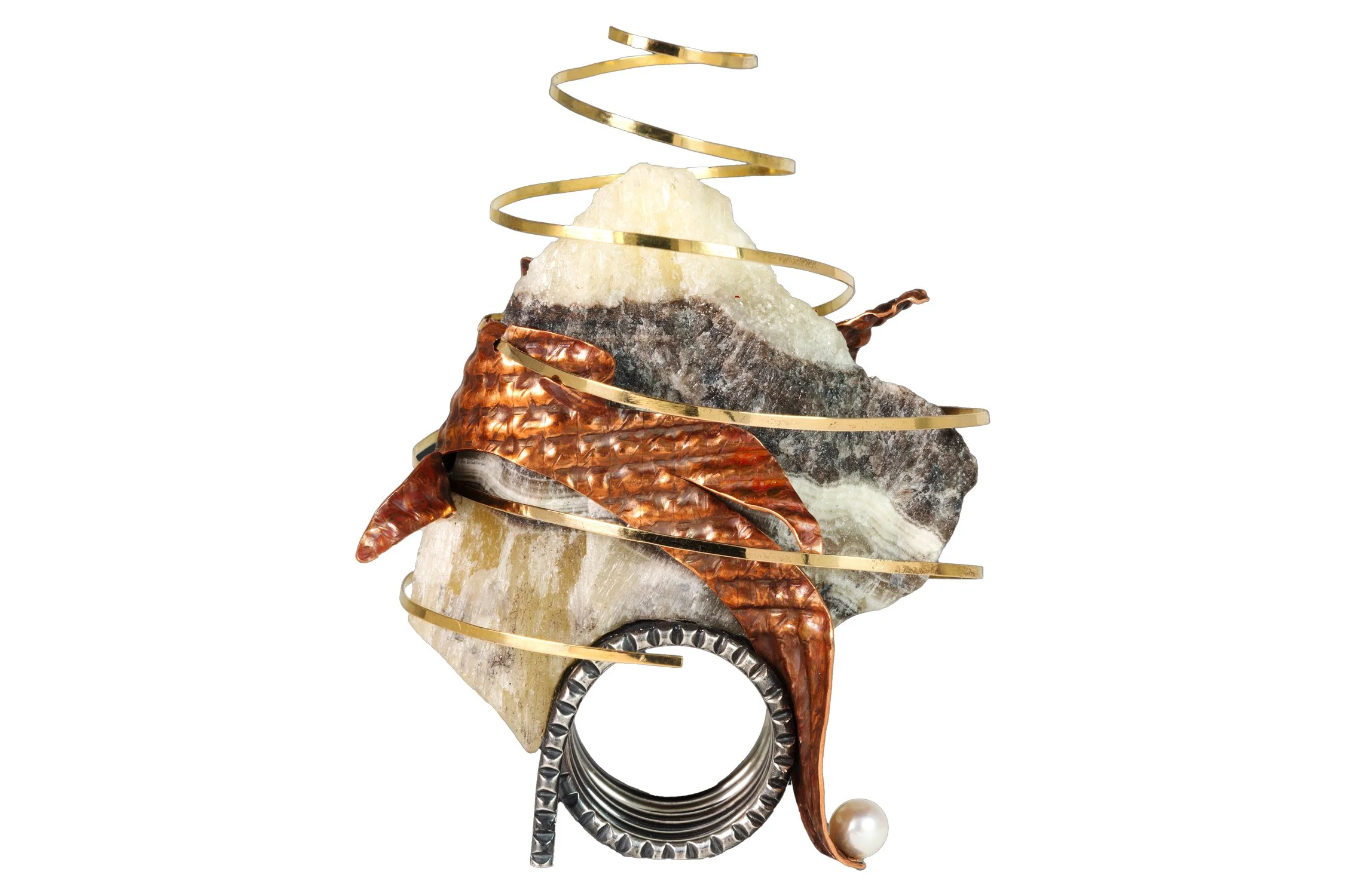 A brooch or decorative jewelry piece featuring a large, irregularly shaped stone, metal spirals, copper-colored leaves, and a pearl.