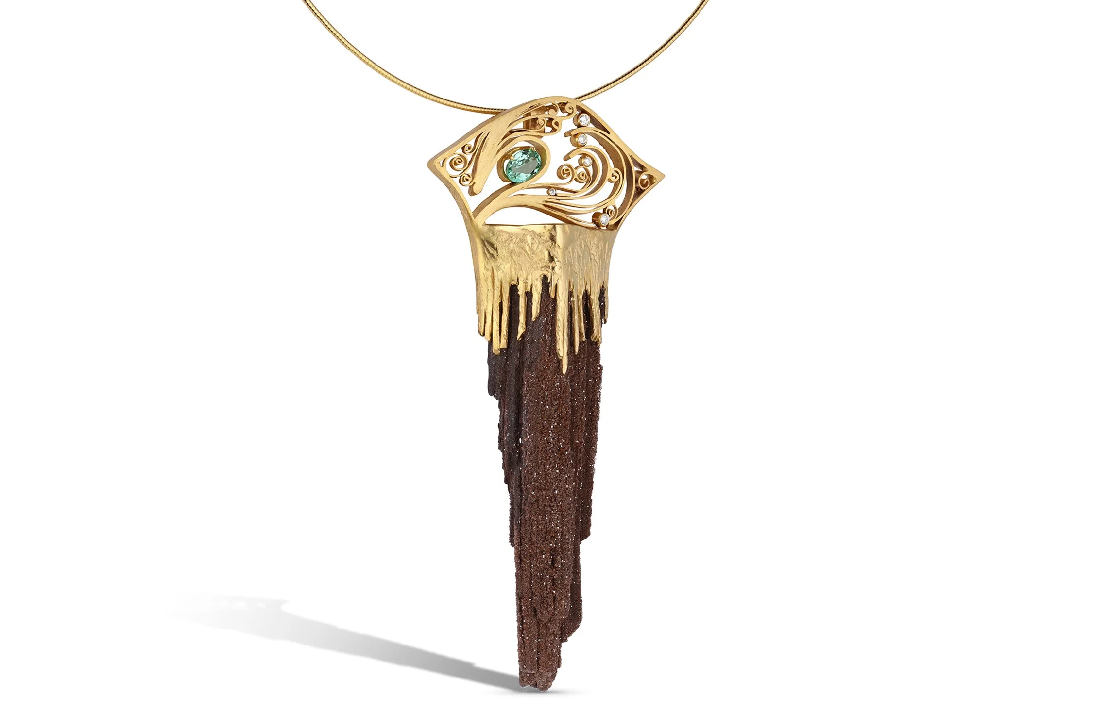 Gold necklace with a pendant featuring an intricate design of a hand holding an eye, adorned with a blue gemstone and small diamonds, hanging from a thin gold chain.