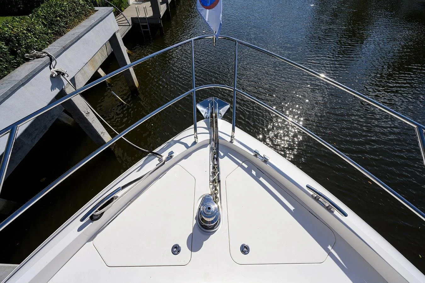Forward bow deck perspective aboard Paulasea, a privately owned Princess 68 Flybridge yacht available for private charter in Palm Beach, Florida.