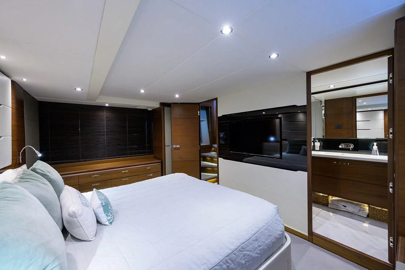Private master stateroom with ensuite access aboard Paulasea, a Princess 68 Flybridge yacht offering exclusive charters in Palm Beach, Florida.