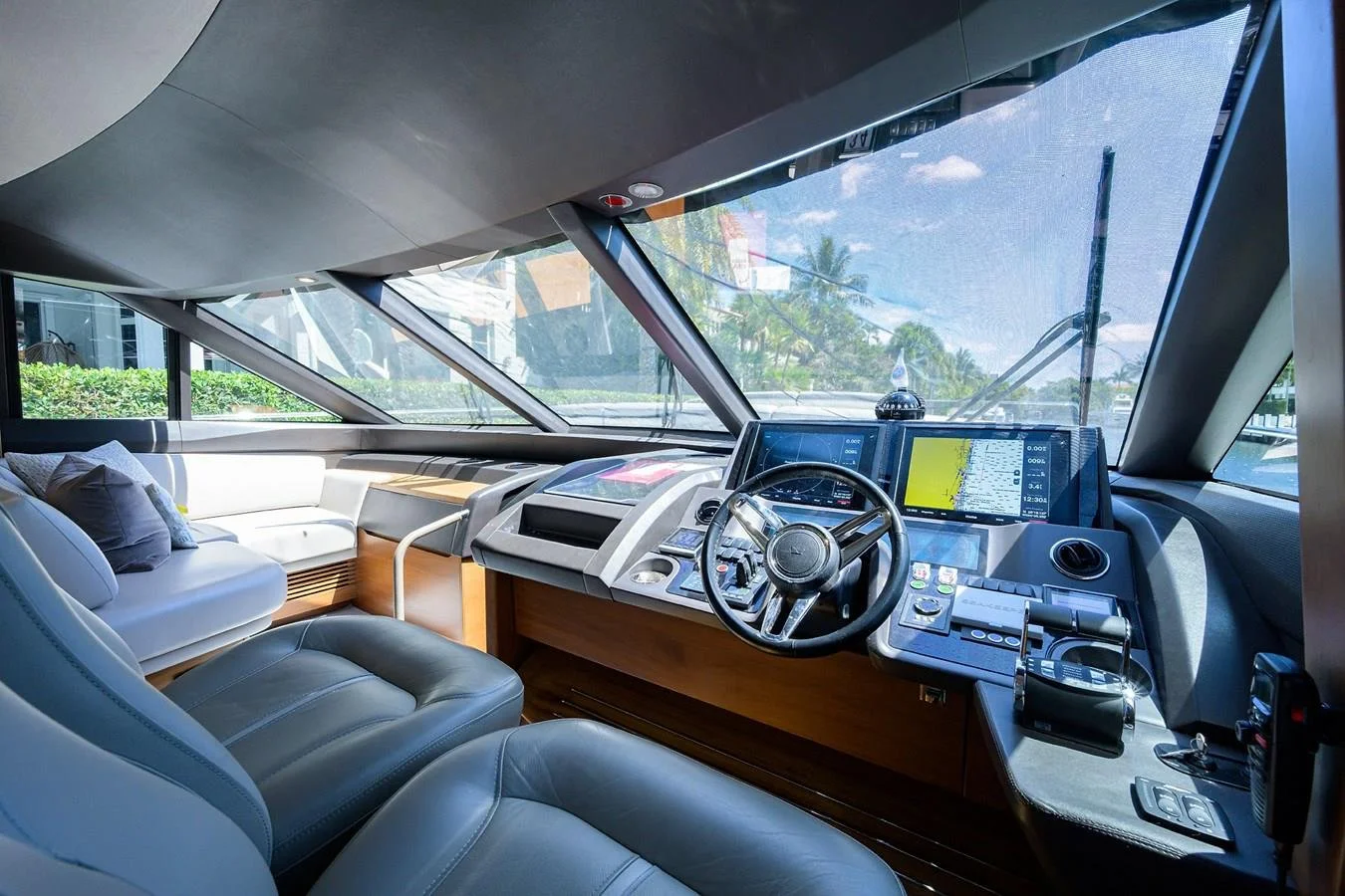 Helm station and navigation controls aboard Paulasea, a privately owned Princess 68 Flybridge yacht available for private charter in Palm Beach, Florida.