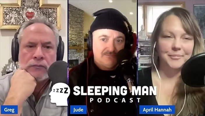 Screenshot of three podcast hosts, Greg, Jude, and April Hannah, participating in the Sleeping Man Podcast, each speaking into microphones with their names labeled in blue boxes below them.