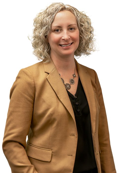 A woman with curly blonde hair wearing a tan blazer and black top, smiling at the camera.