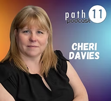 A woman with shoulder-length blonde hair wearing a black blouse, standing in front of a purple gradient background with white text that reads 'path podcast 11' and 'Cheri Davies'.