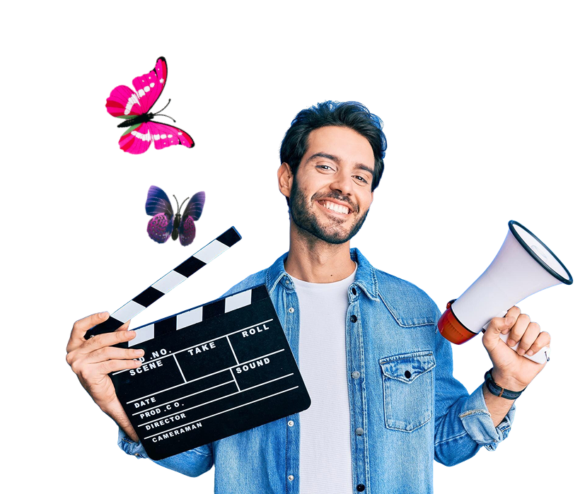 A young man holding a clapperboard and a megaphone, smiling, with two colorful butterflies flying nearby, against a black background.
