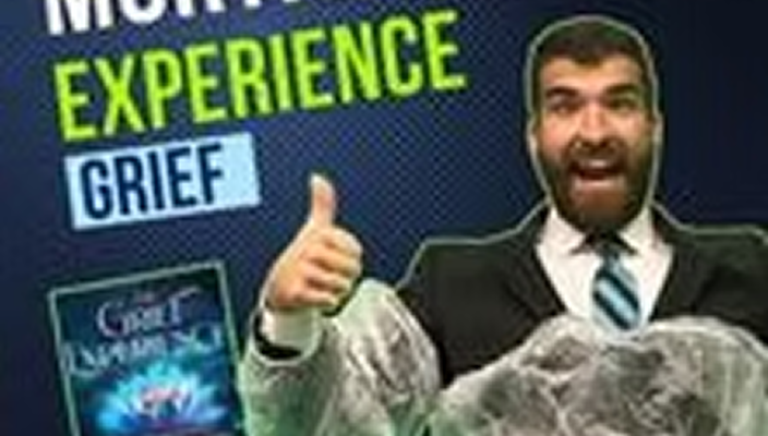 A man in a suit and tie giving a thumbs up at a conference with a slide that says 'Mourning, Experience, Grief' in the background.