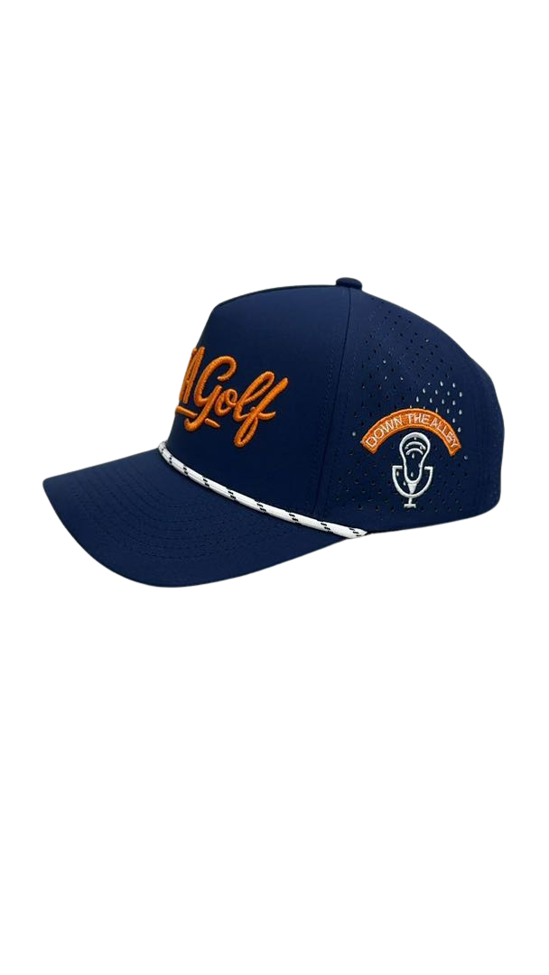 A navy blue golf cap with orange embroidered text 'Golf' and a patch that says 'Down the Alley' with a microphone icon.