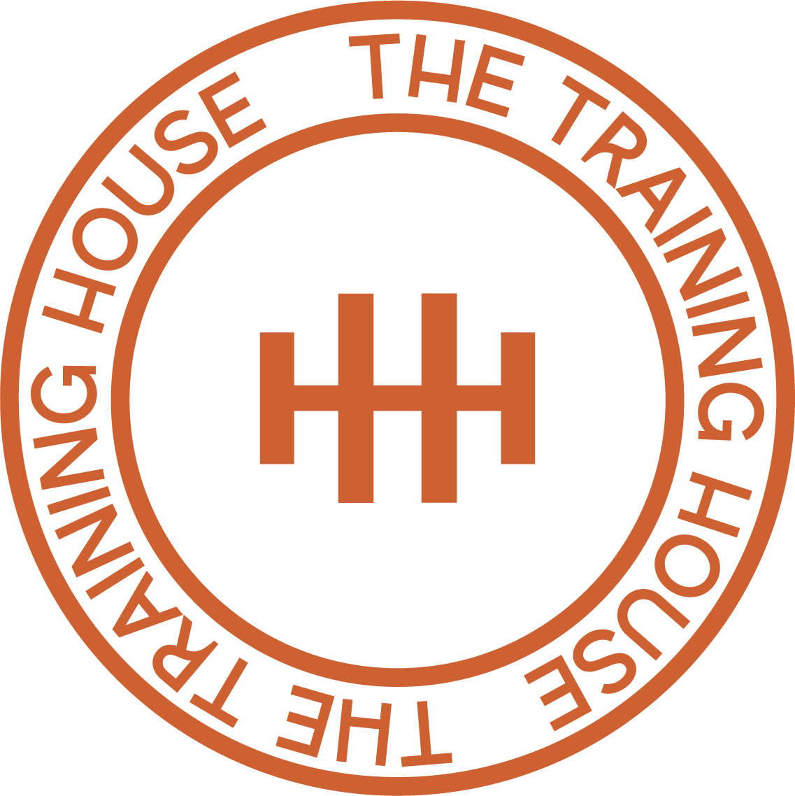 Circular logo with the words, "The Trainwreck House" and "Helping House The" around the outer edge, with a stylized house symbol in the center.