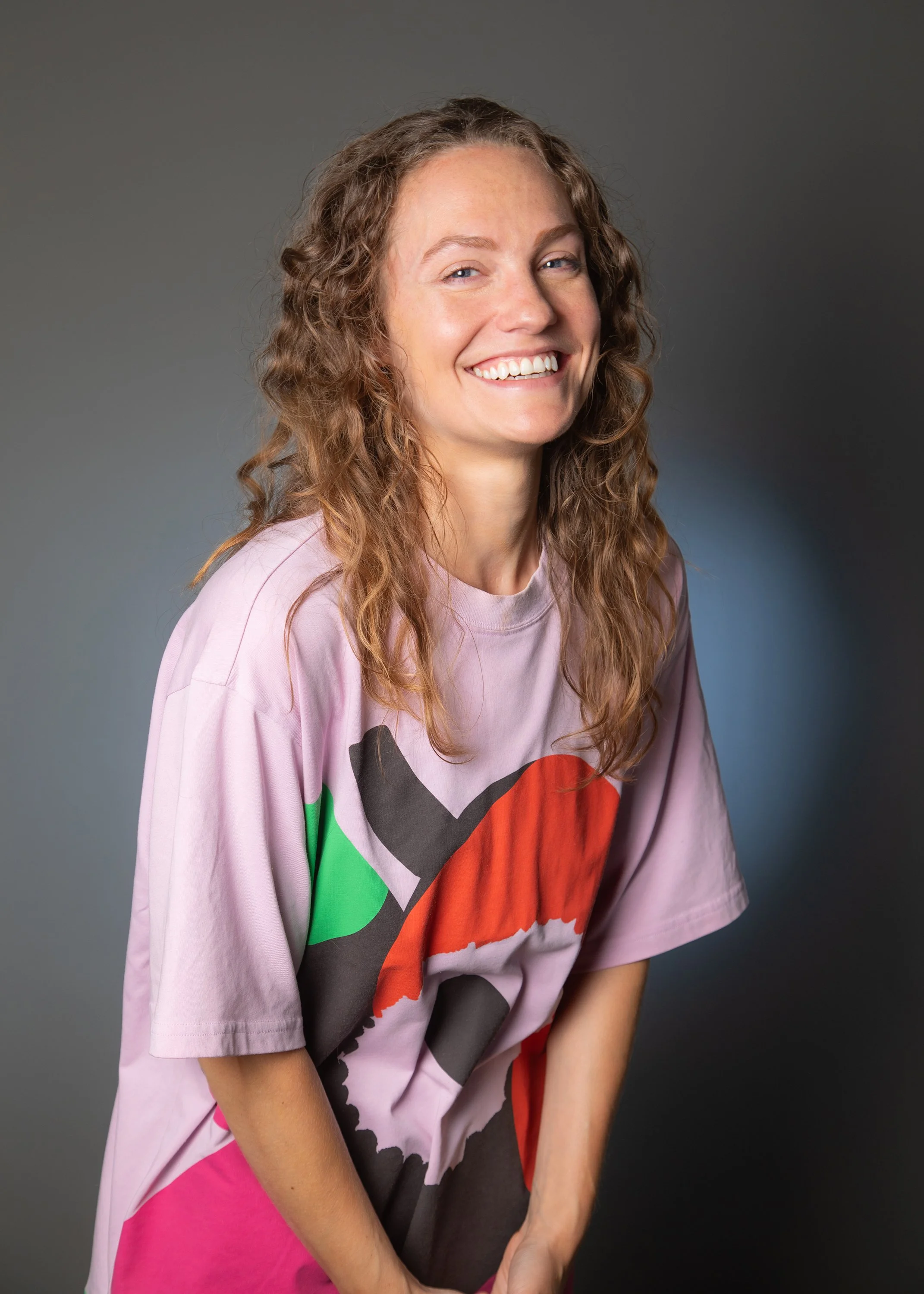 White woman in her 30s with long brown hair