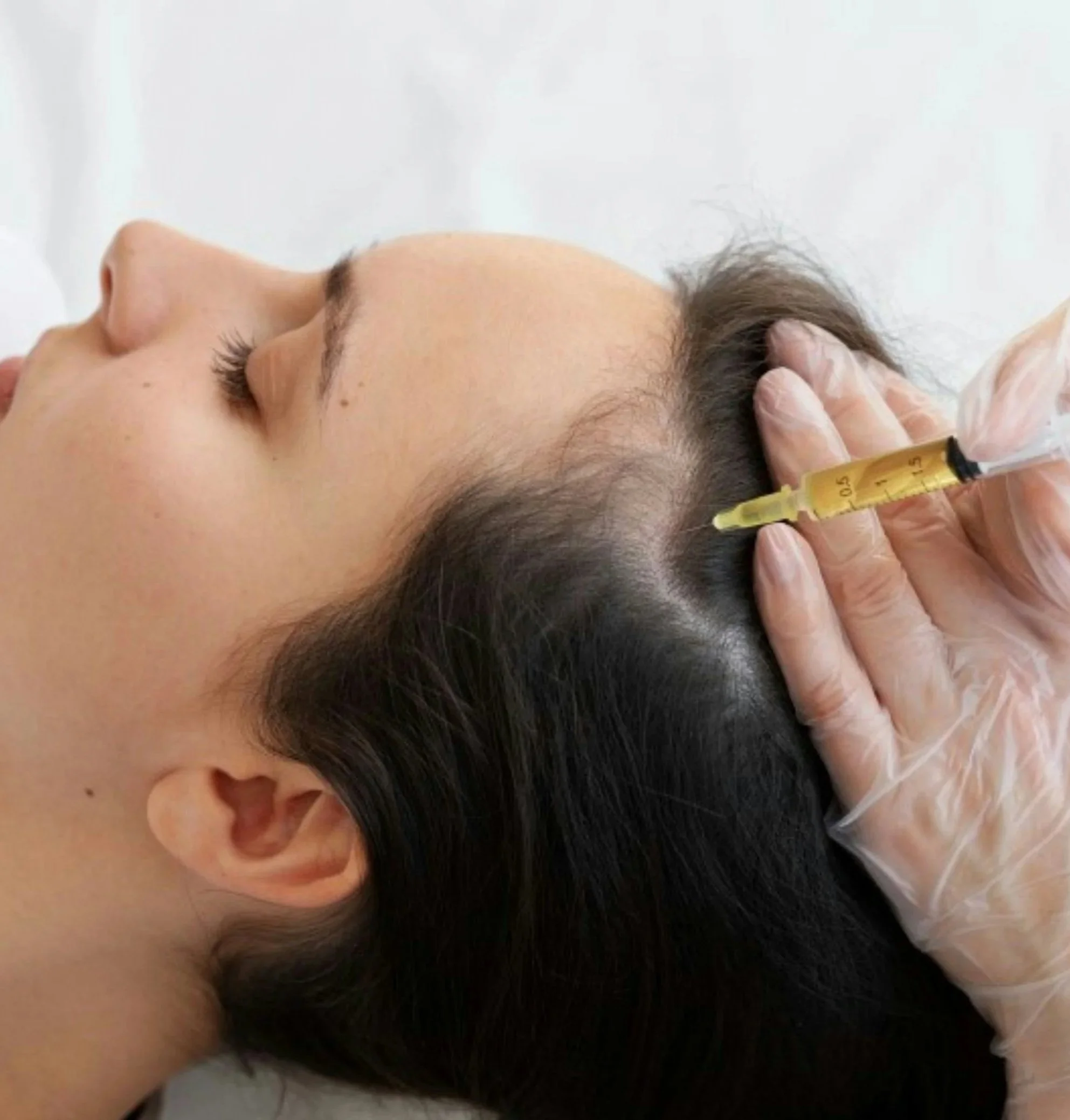 Medical professional administering a shot or injection to a person's neck or shoulder area.