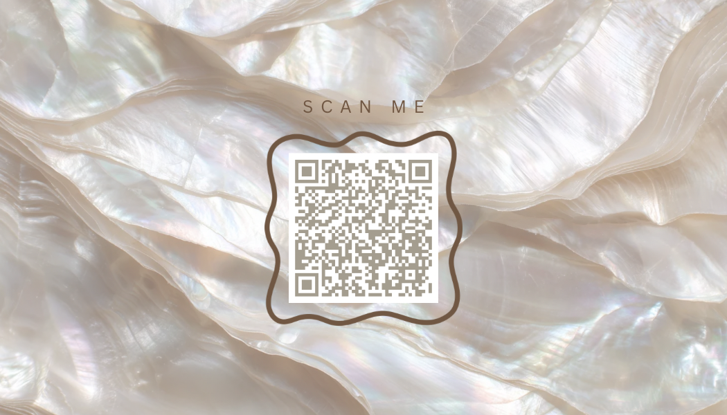 A QR code on a background of iridescent pearl-like shells, with the text 'SCAN ME' above.