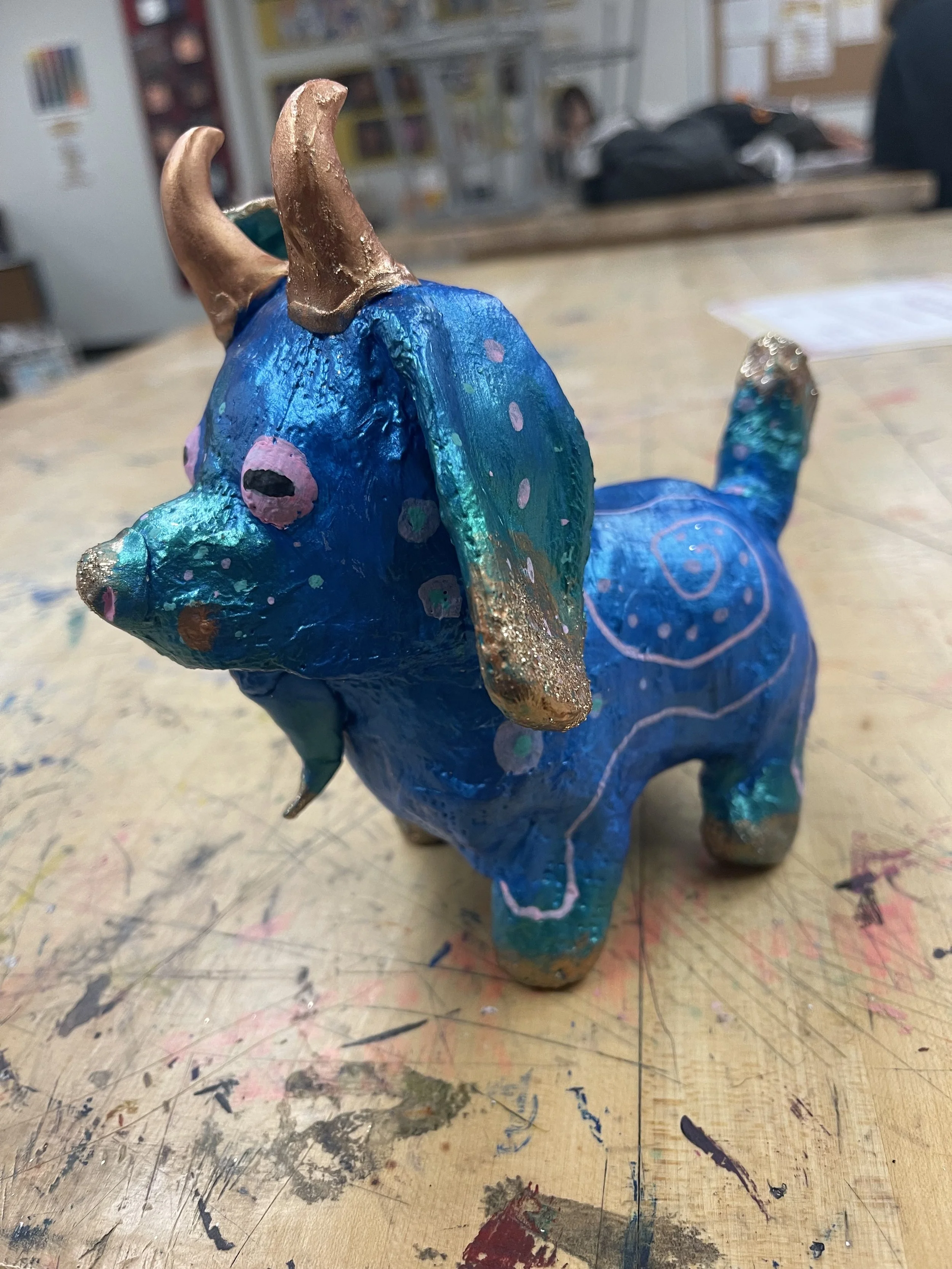 Medium: Toy dog, plaster wrap, clay, acrylic paint, and paint pens