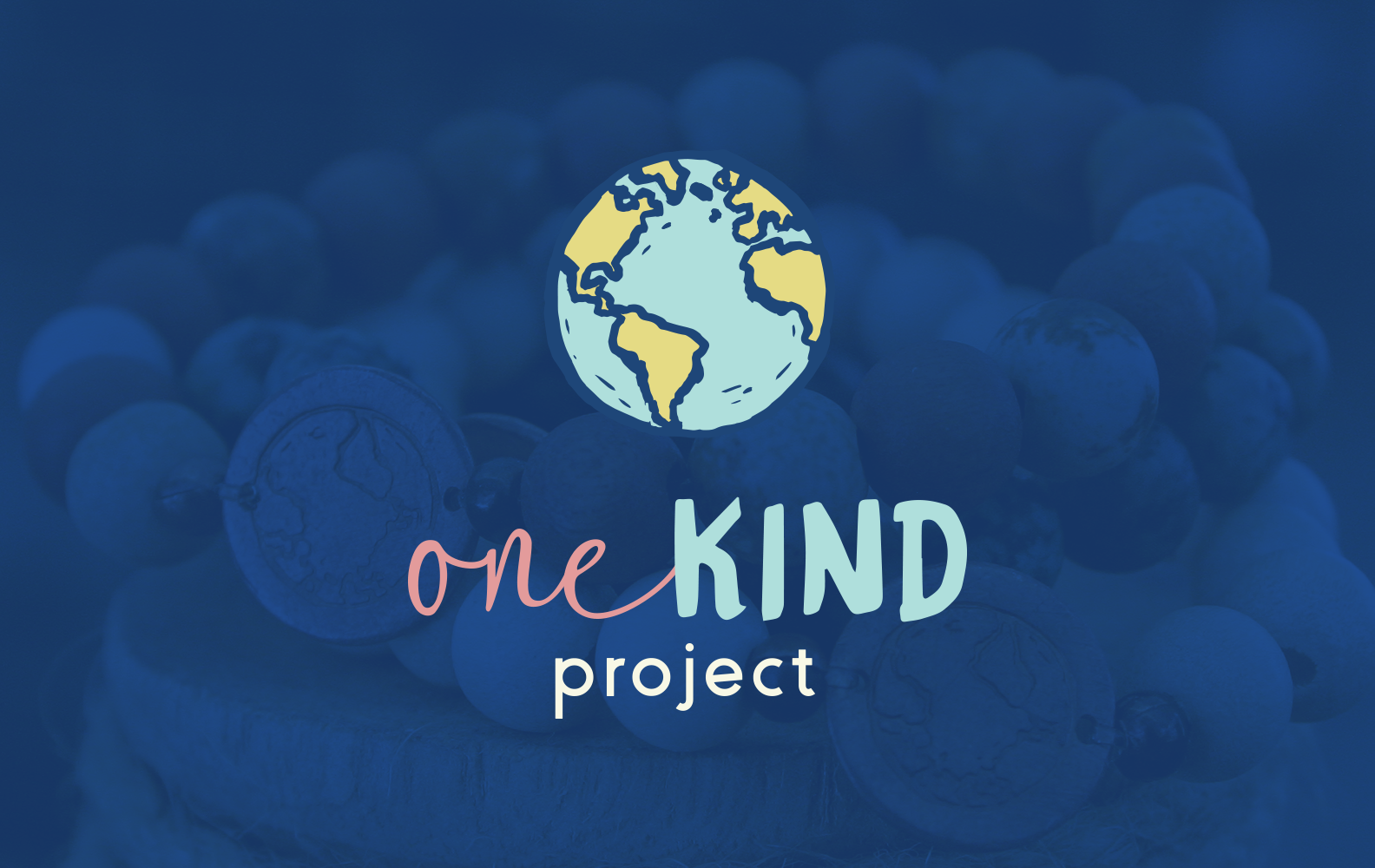 Illustration of a globe showing North and South America, with text 'one KIND project' beneath it, set against a background of blueberries.