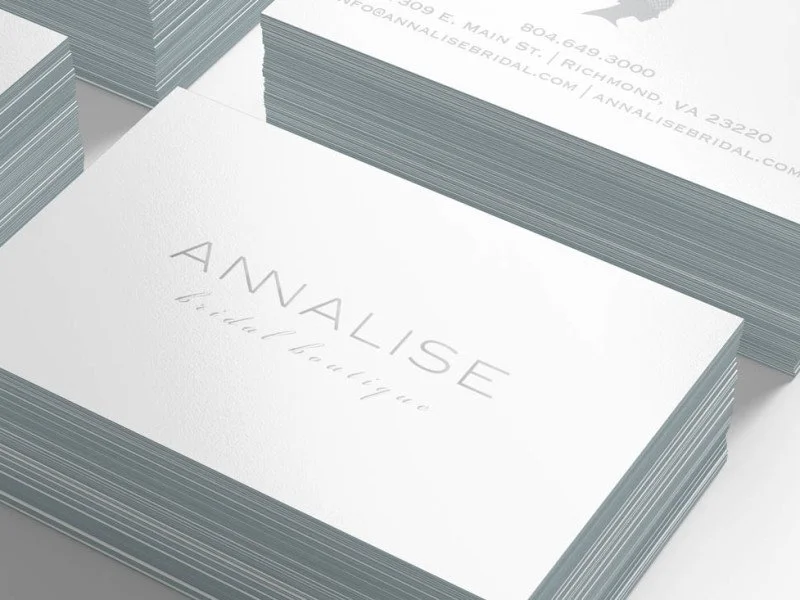Close-up of stacked business cards with the word 'ANALISE' and the phrase 'detail styling' on the top card.