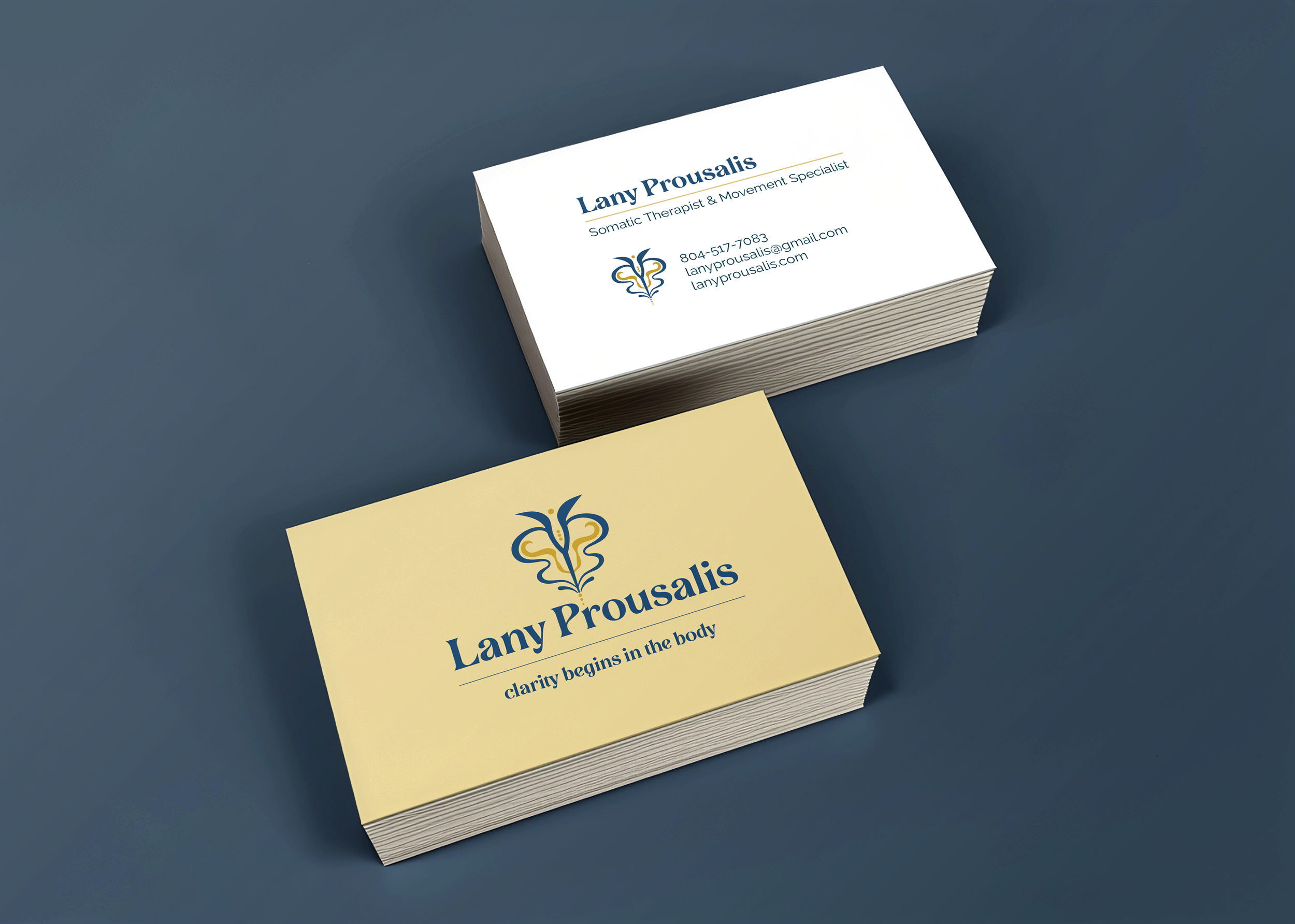 Business cards for Lany Prousalis, a somatic therapist and movement specialist, on a blue background. The cards feature a logo and contact information.
