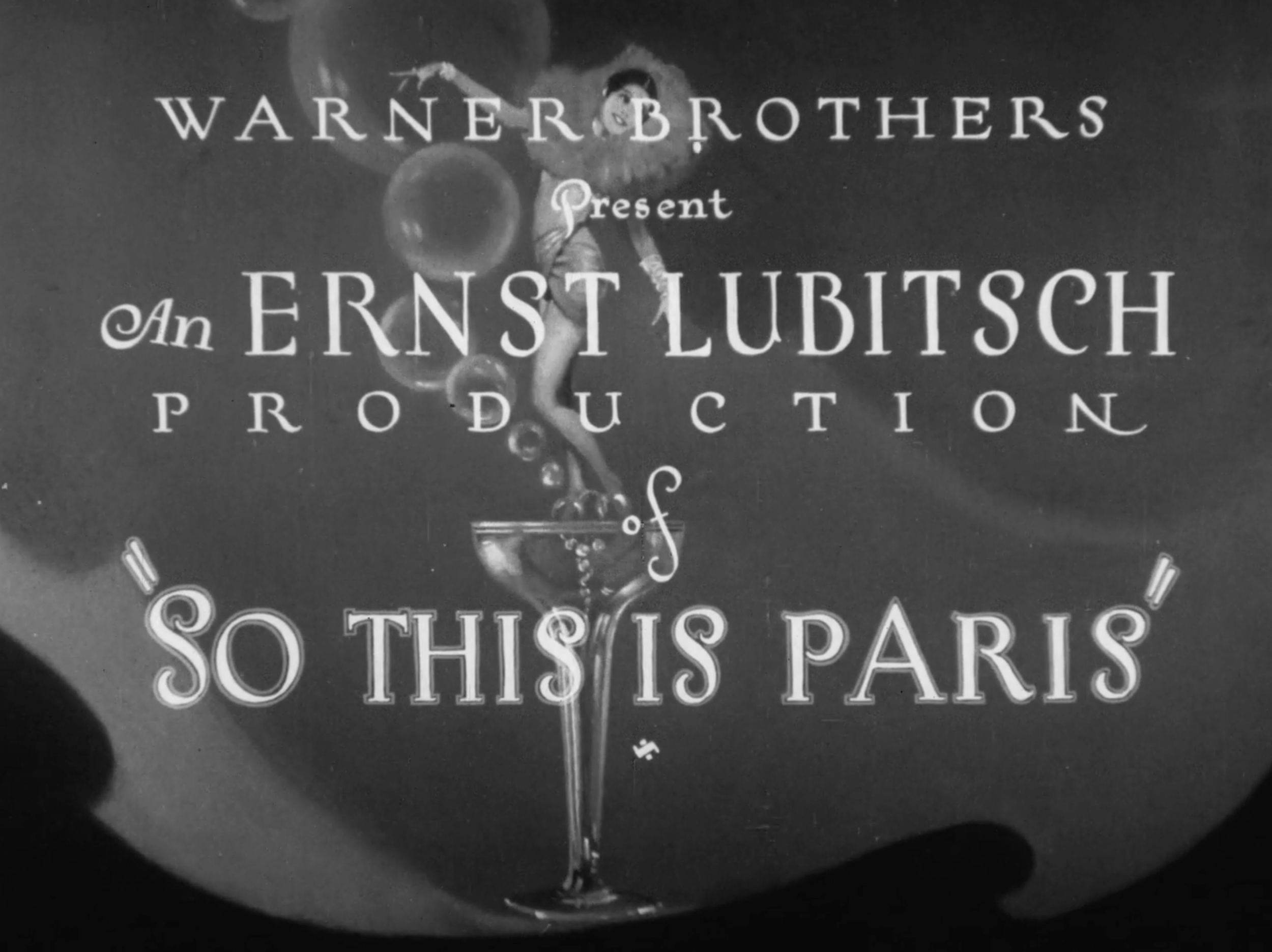 Title card for Warner Brothers presenting Ernst Lubitsch production with a dancing woman's figure and bubbles.