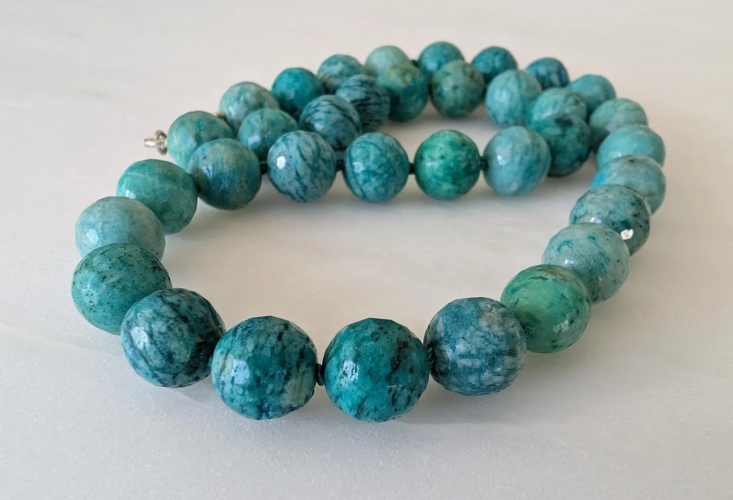 Amazonite. One of the most versatile semi precious gemstones. A must in my wardrobe. For when you need a go-to strand that you know will work. This darker more saturated variation is Russian Amazonite. These are knotted for an elevated look and organ