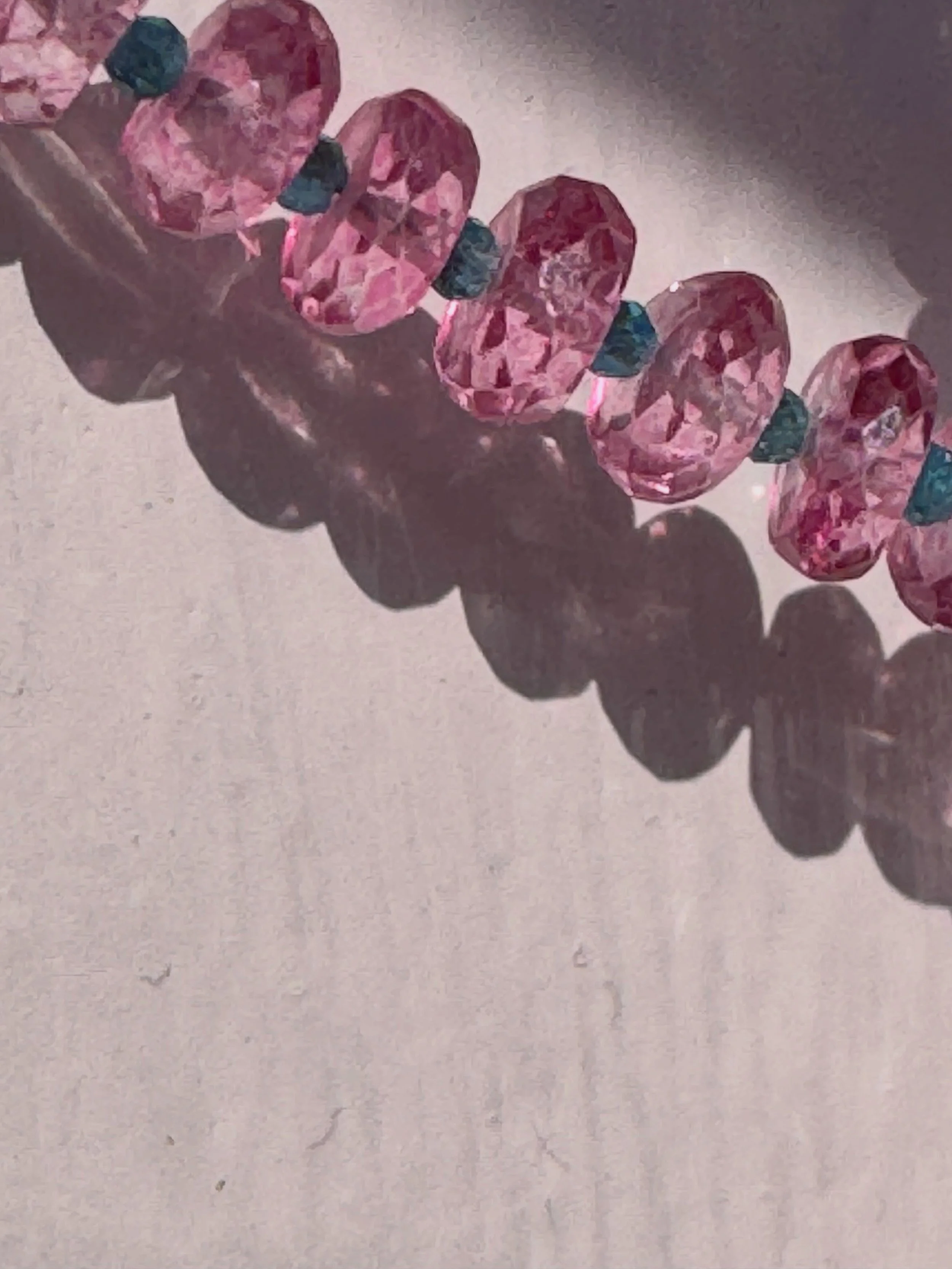 My daughter has taken to photography and I just found this photo of a Ruby &amp; Co. necklace on my phone. It perfectly illustrates something I&rsquo;ve been thinking about today. Have you heard the term glimmer in reference to healing? It is used in