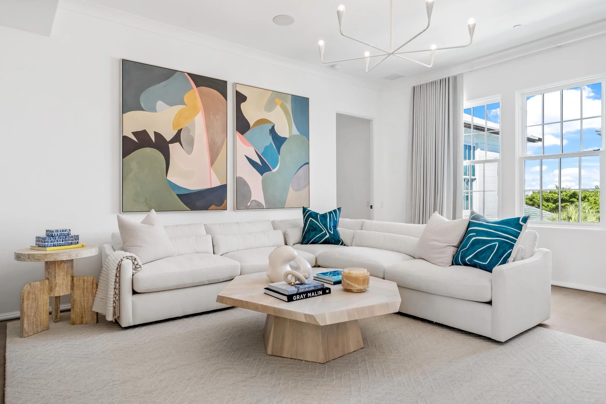 Coastal living room with neutral furnishings and custom wood table