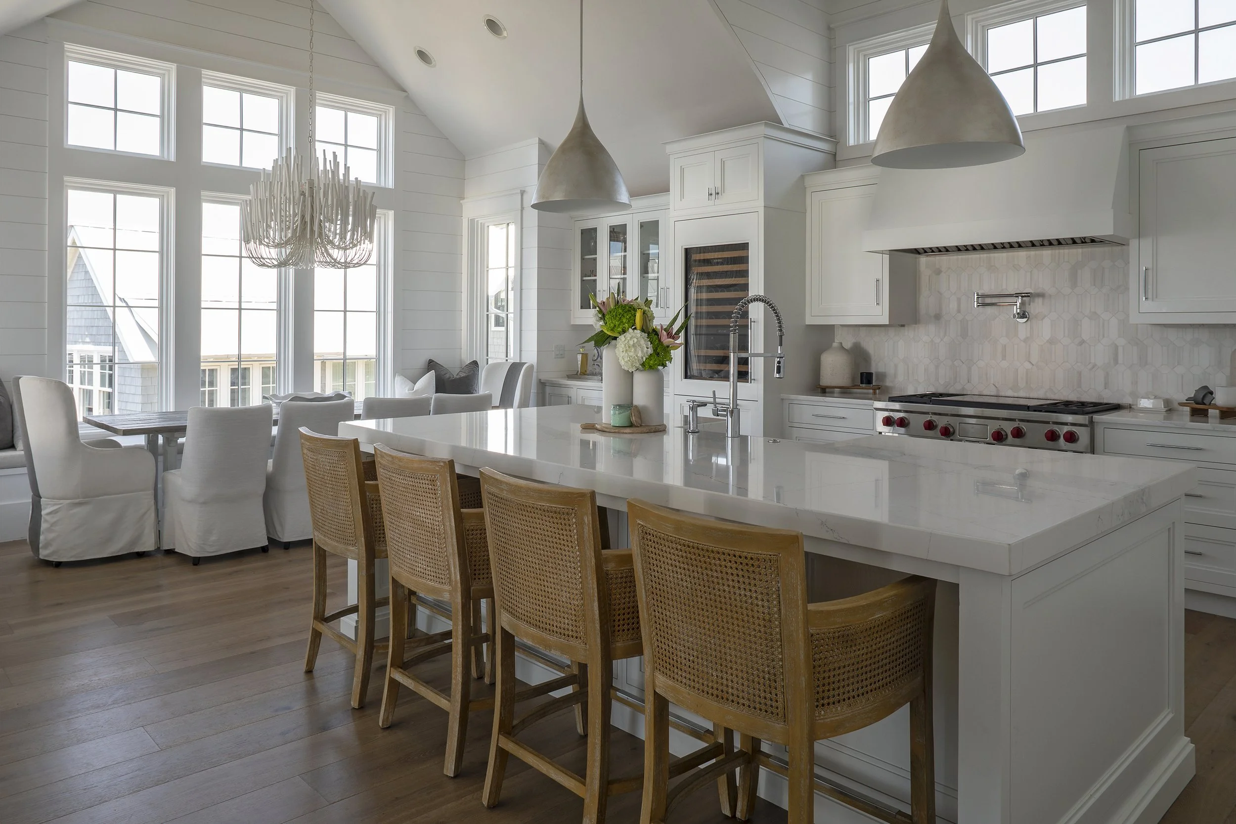 Open coastal kitchen and living space with custom finishes