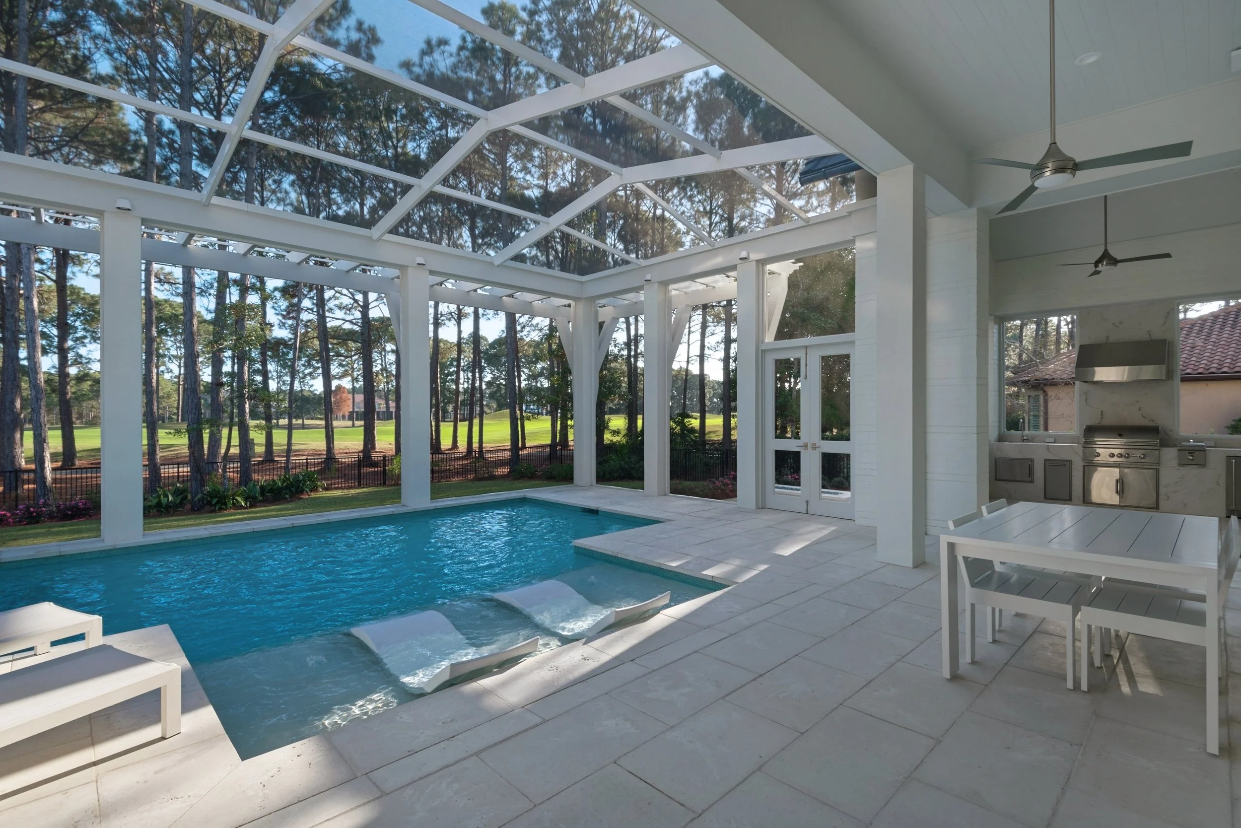 Screened-in pool and outdoor living space in a luxury custom-built home