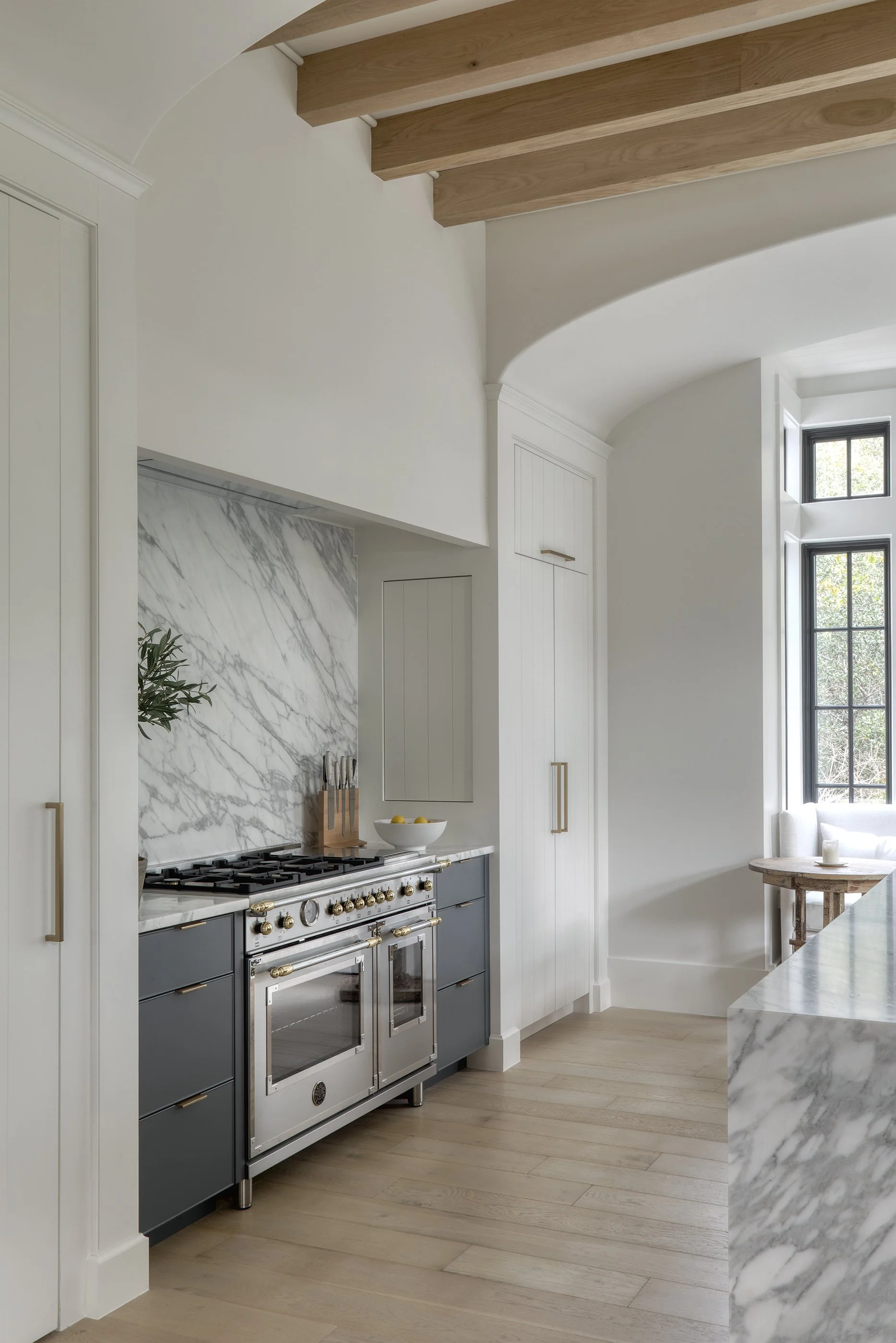 High-end kitchen remodel with custom cabinetry and marble finishes