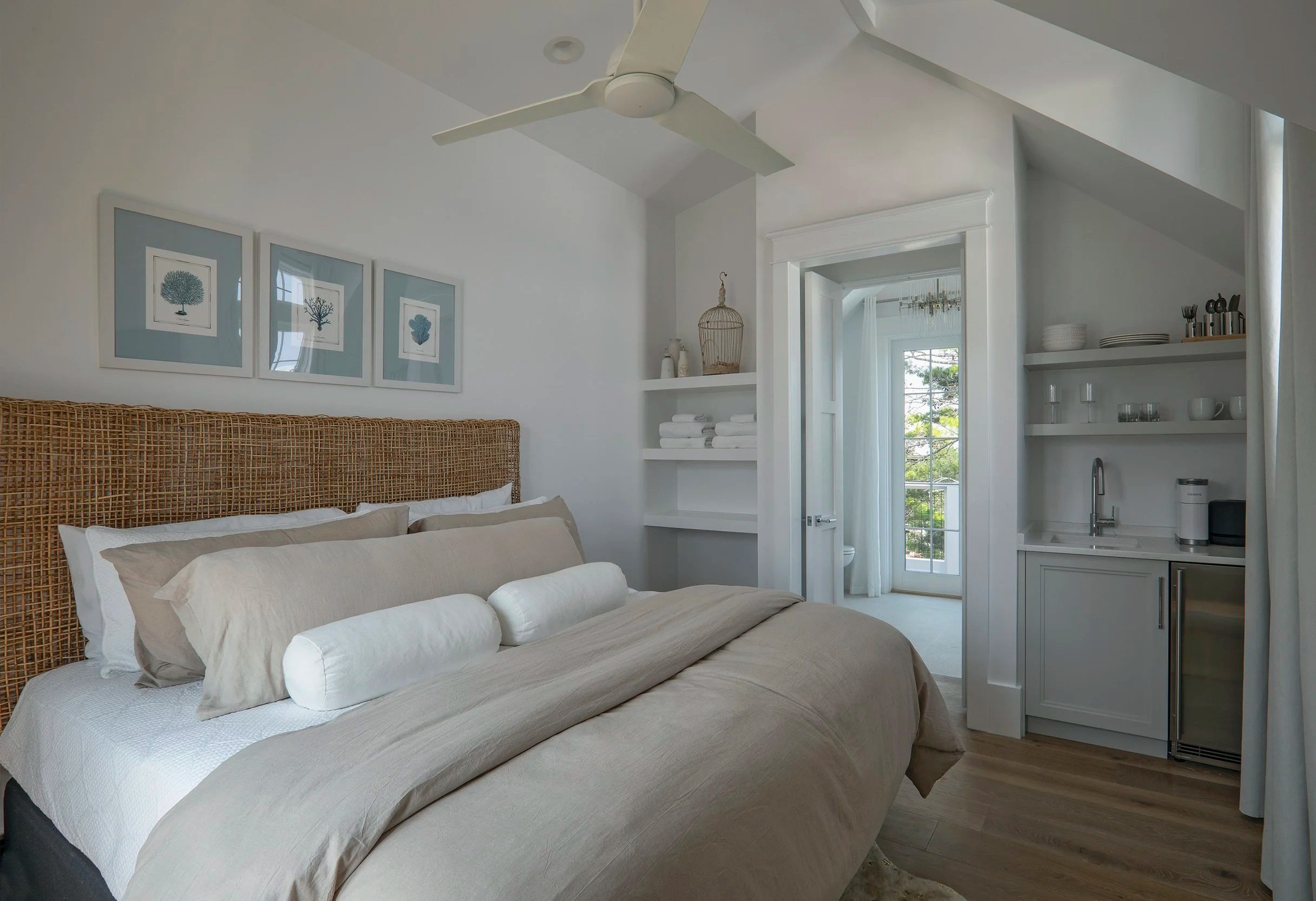 Coastal bedroom with neutral tones and custom built-ins