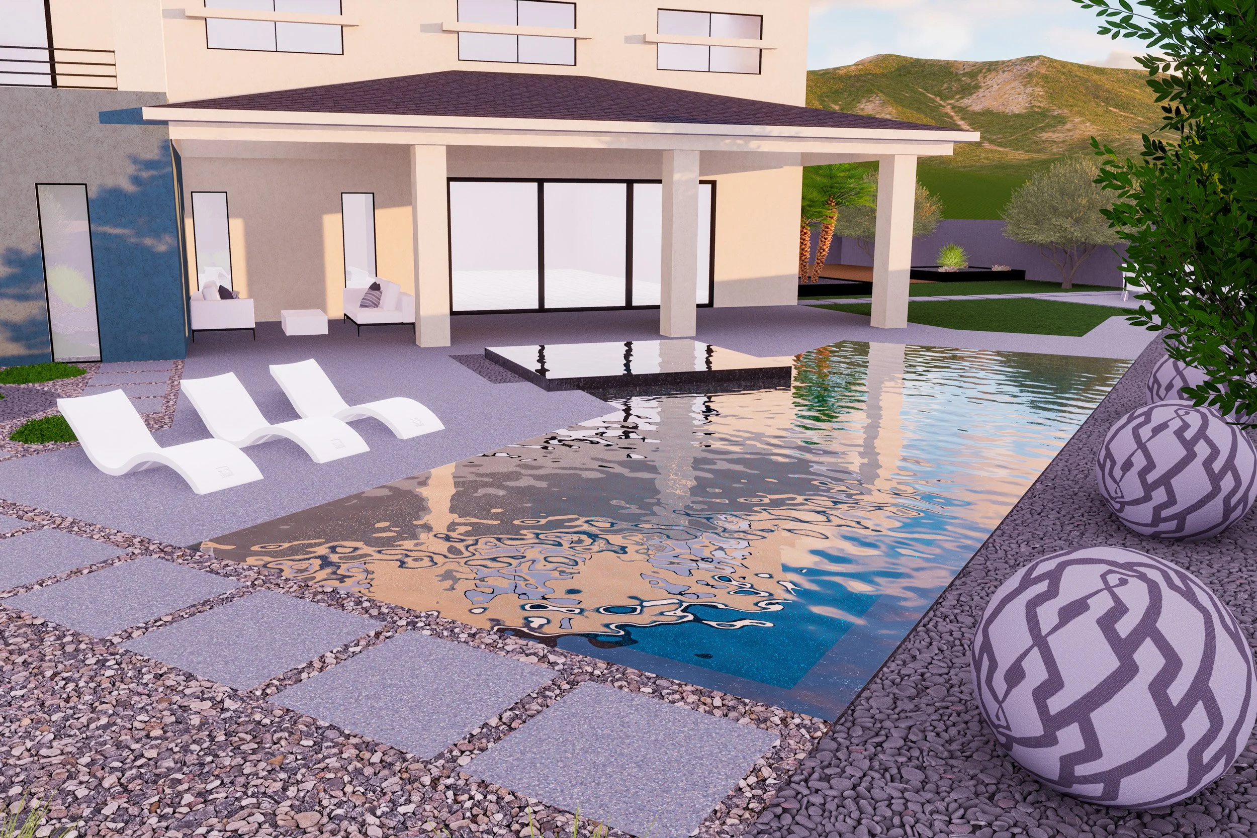 Modern backyard with a swimming pool, three white lounge chairs, gravel and stone pathway, a two-story house with a covered patio, decorative planters, and mountain scenery in the background.