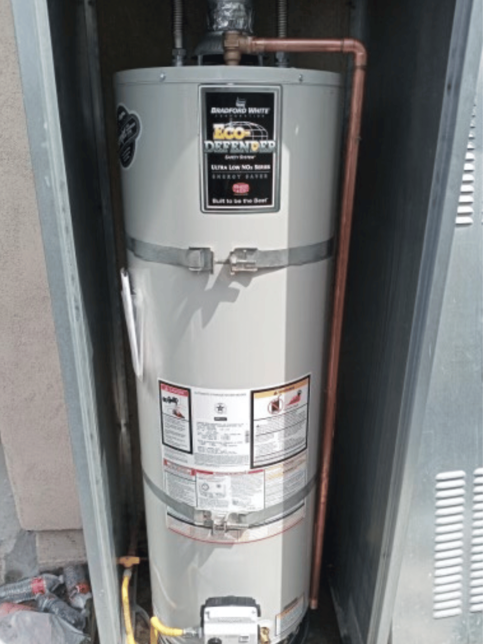 Chavez Plumbing technician installing a new residential water heater with professional tools.