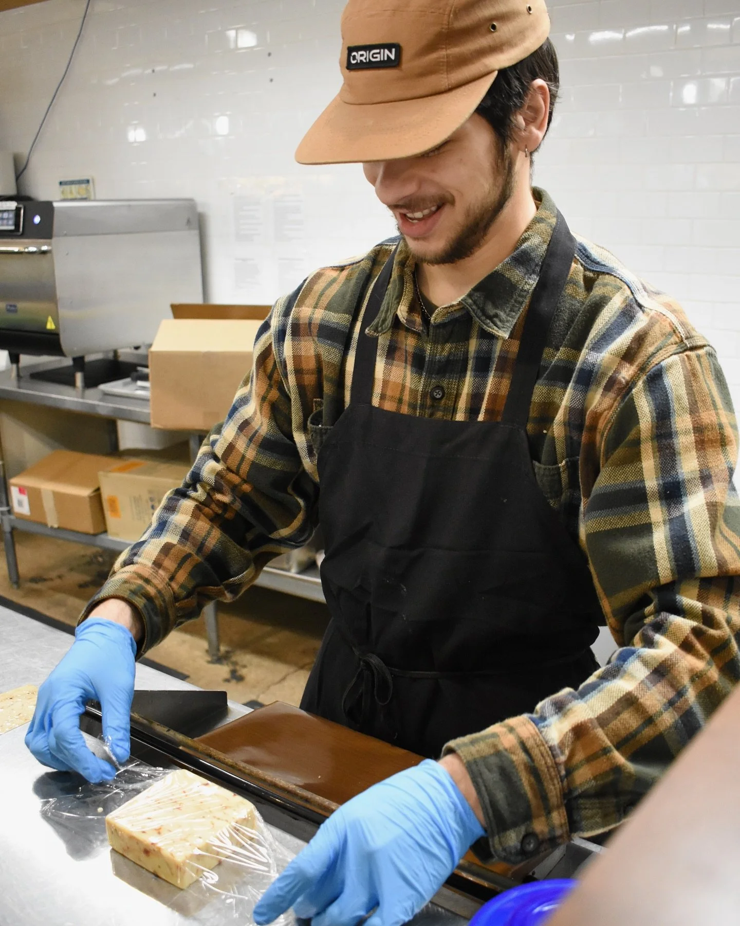 Brendan wrapping cheese.jpg
