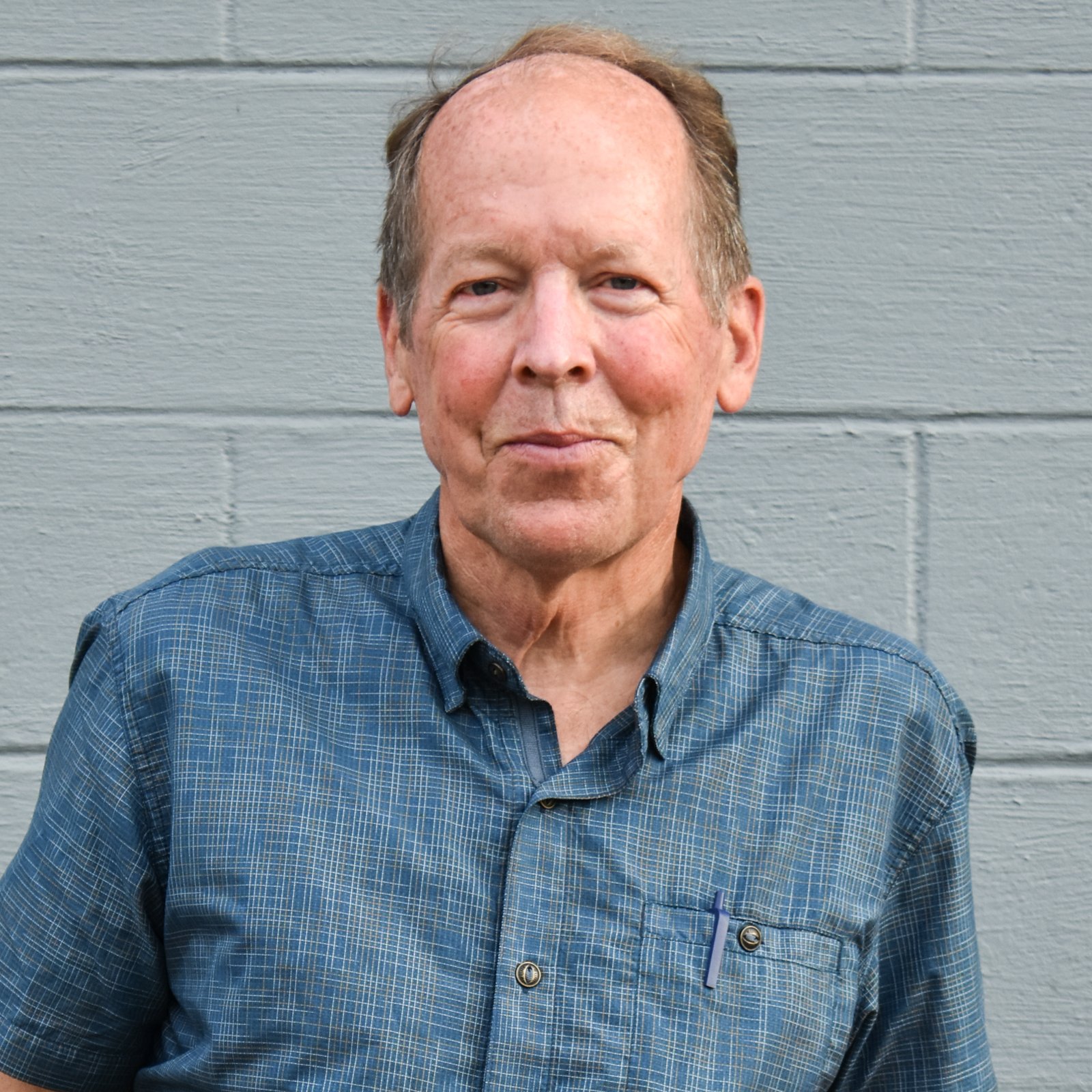 Tom Rulseh Man inBlue Shirt
