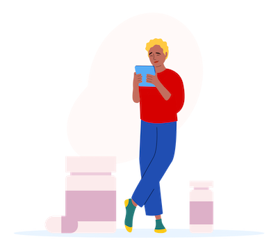 A person with blonde hair, wearing a red shirt and blue pants, standing and looking at a smartphone, with a bottle and some boxes nearby.