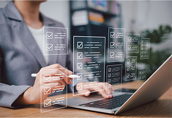 Person using a laptop with digital checklists or forms projected in front of them.