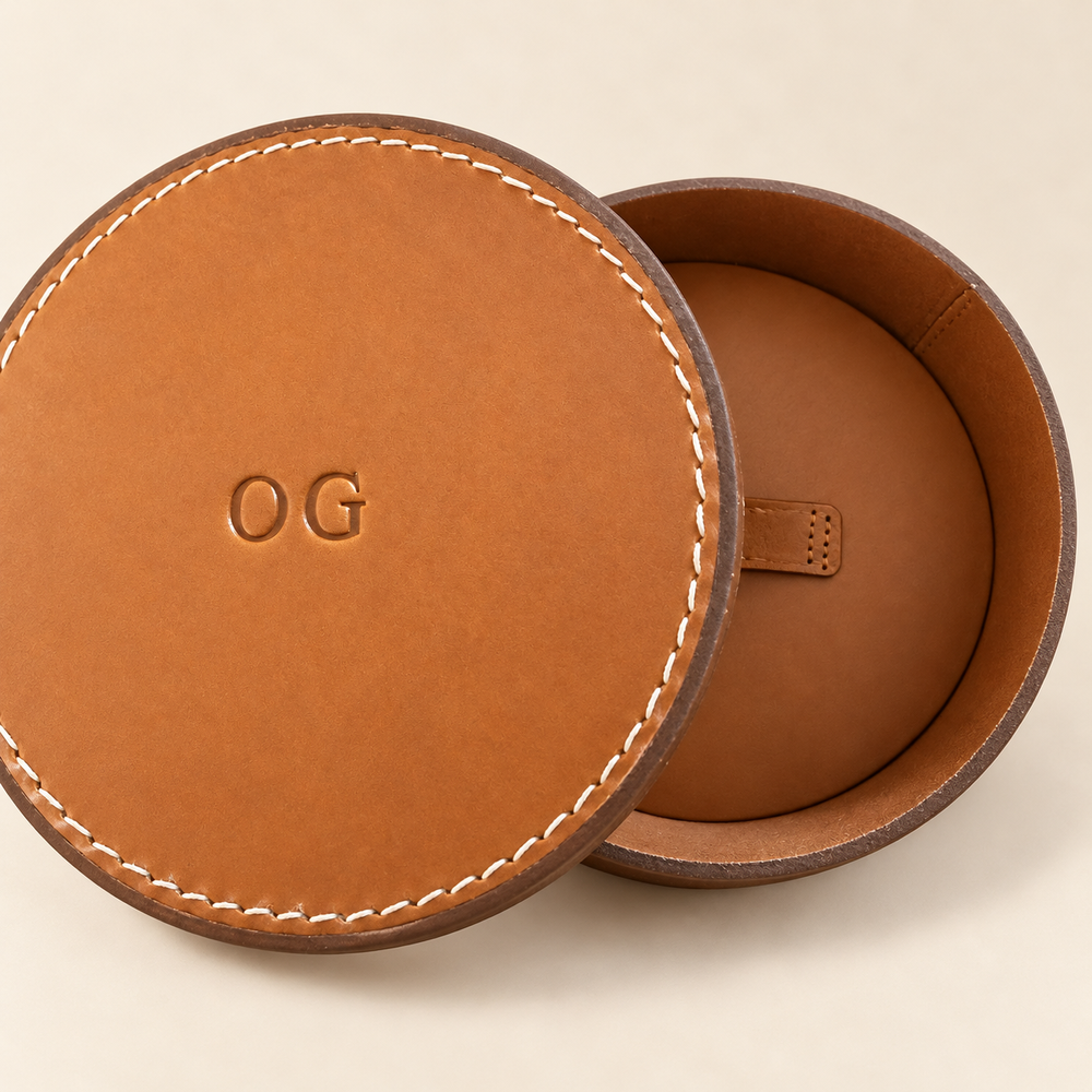 RQVM leather urn with its outer lid removed and the inner lid visible