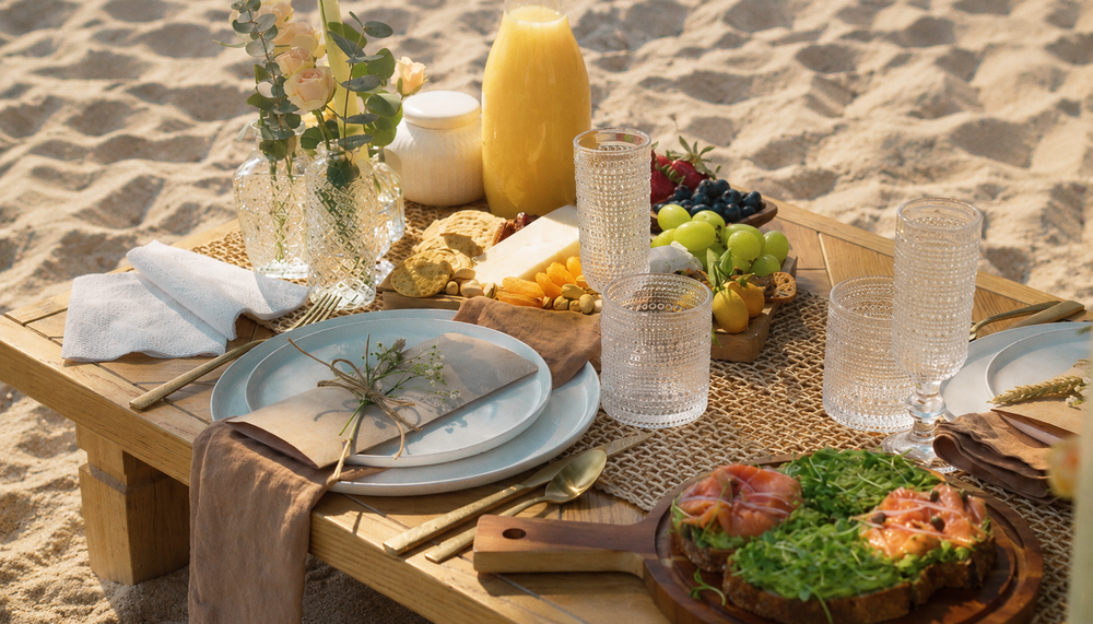 A breakfast table set by the ocean